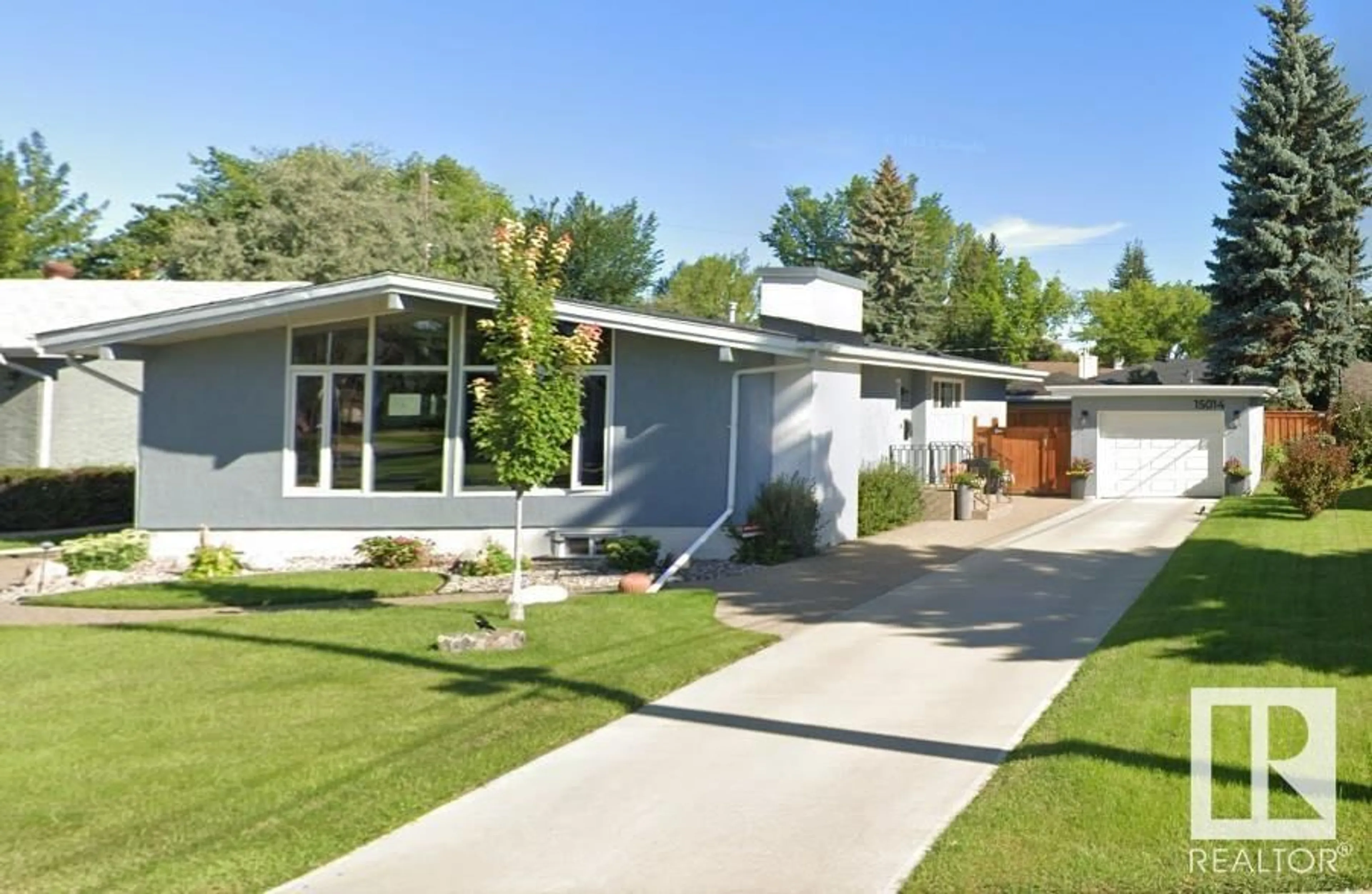 Home with vinyl exterior material, street for 15014 75 AV, Edmonton Alberta T5R2Y7