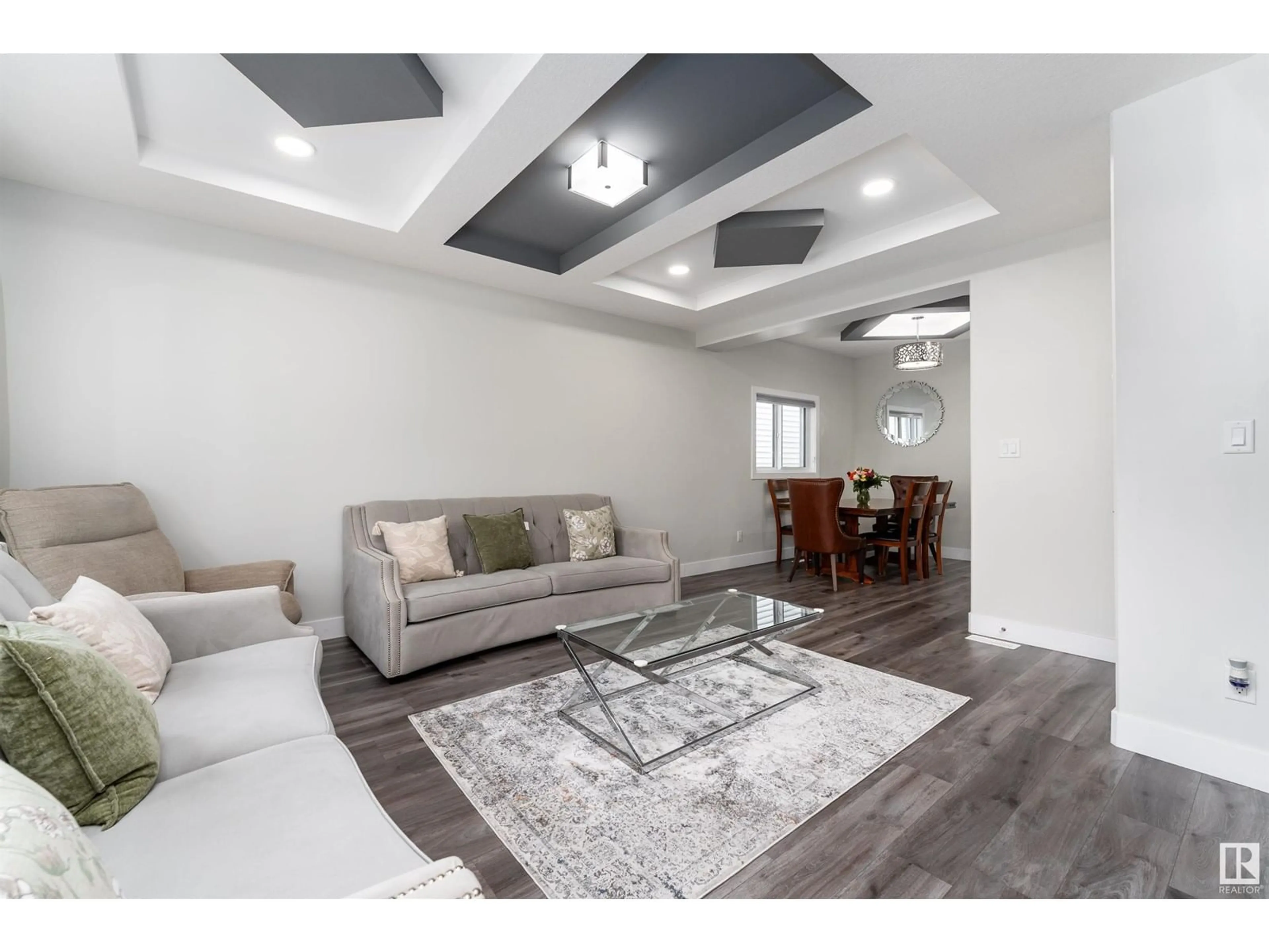 Living room with furniture, wood/laminate floor for NW - 1723 26A ST, Edmonton Alberta T6T2H9
