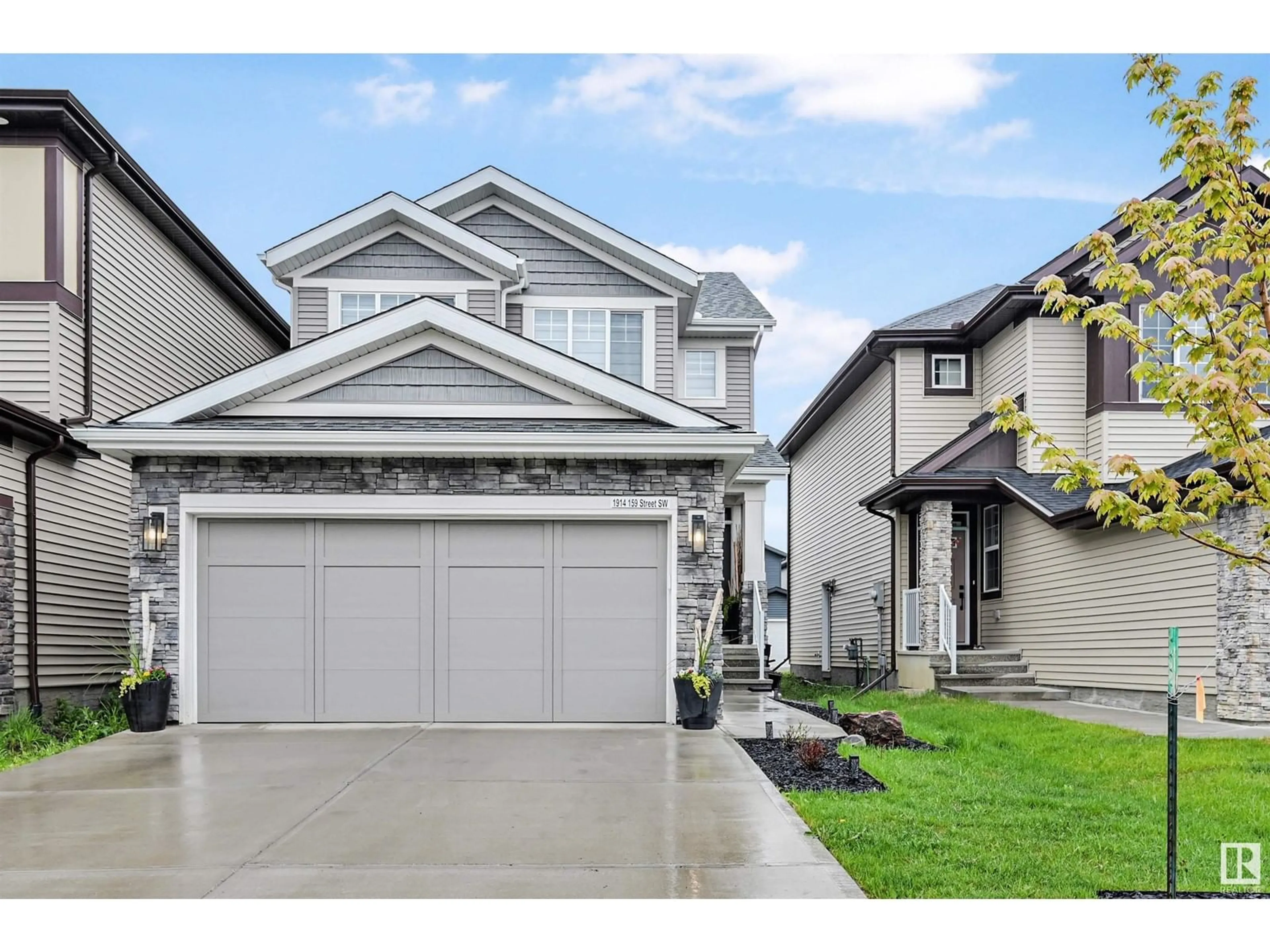 Home with vinyl exterior material, street for SW - 1914 159 ST, Edmonton Alberta T6W4X7