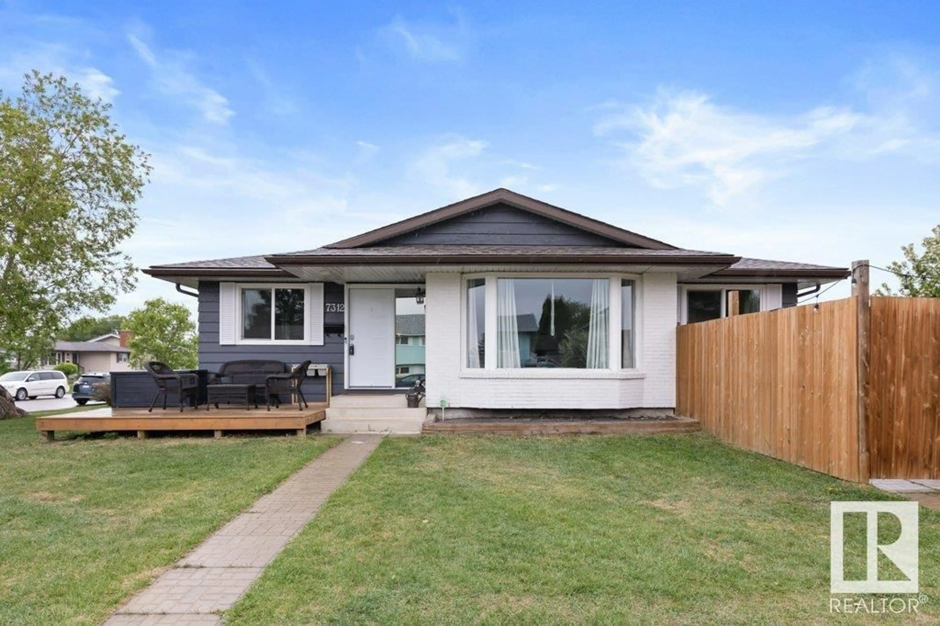 Home with vinyl exterior material, street for 7312 150 AV, Edmonton Alberta T5C2X8
