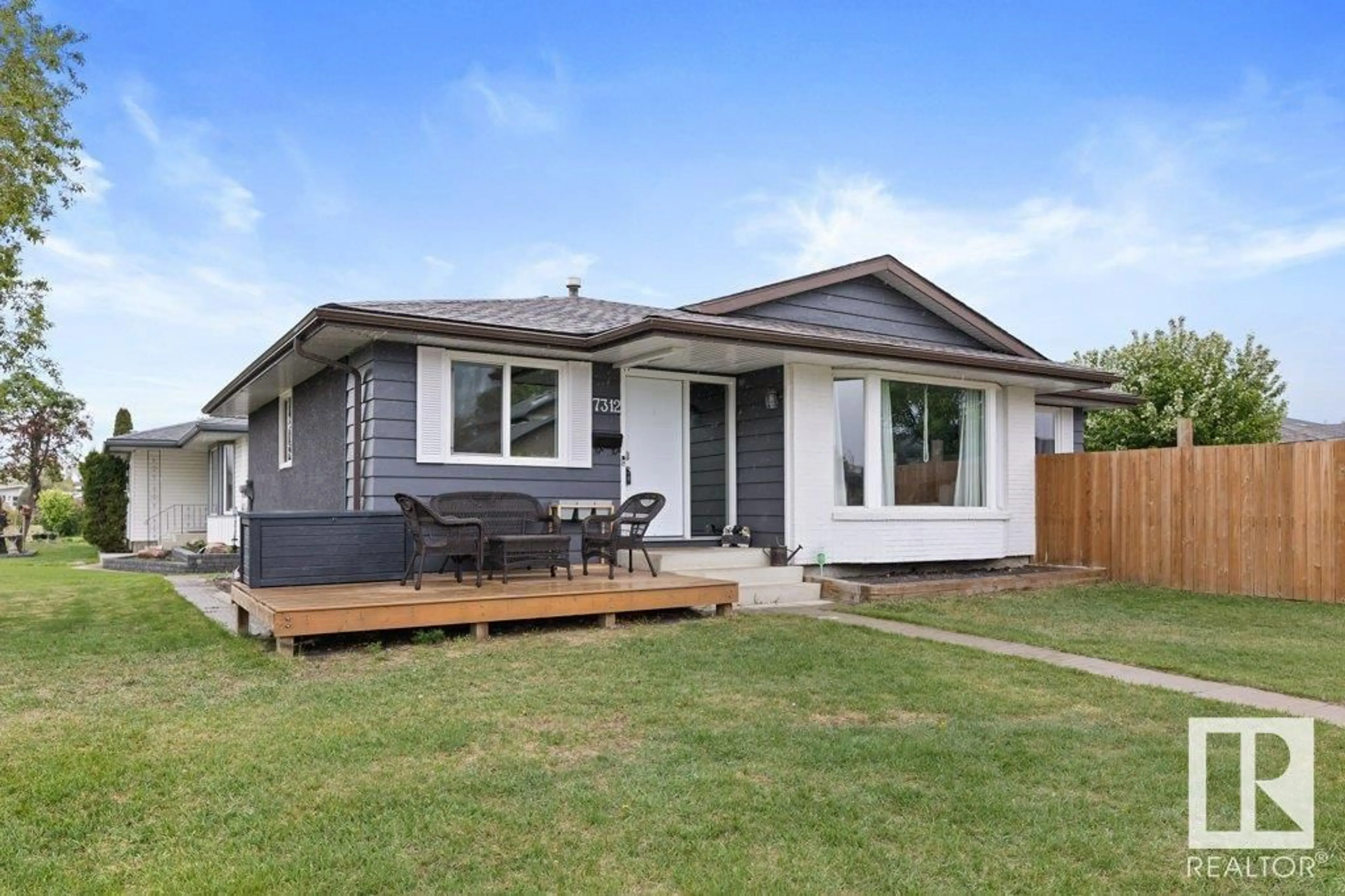 Home with vinyl exterior material, street for 7312 150 AV, Edmonton Alberta T5C2X8