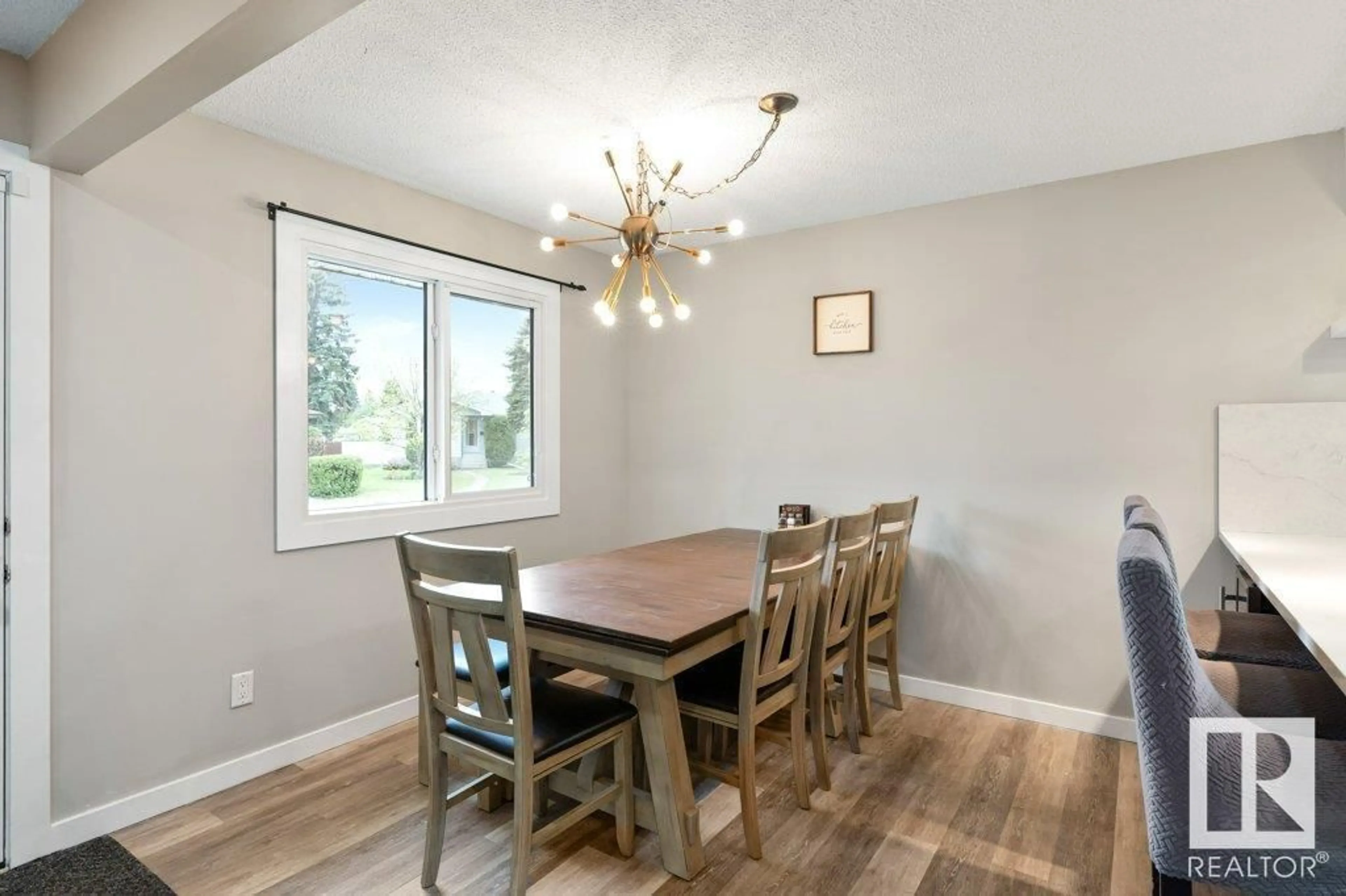 Dining room, wood/laminate floor for 7312 150 AV, Edmonton Alberta T5C2X8