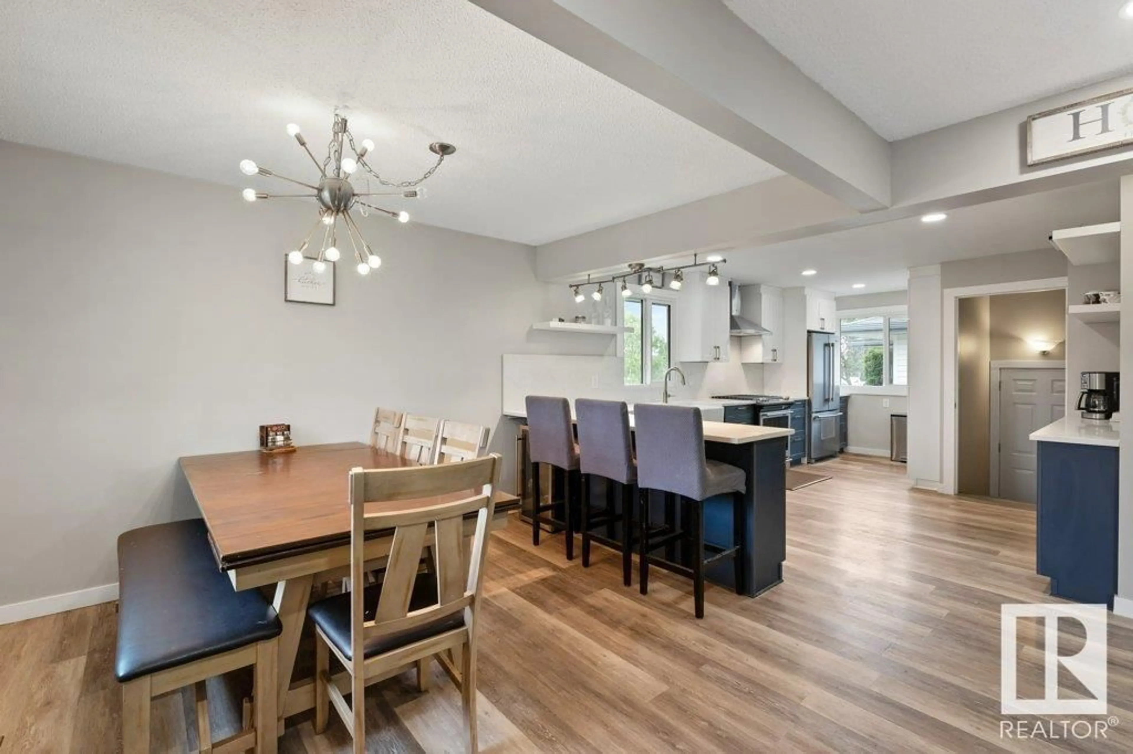 Open concept kitchen, wood/laminate floor for 7312 150 AV, Edmonton Alberta T5C2X8