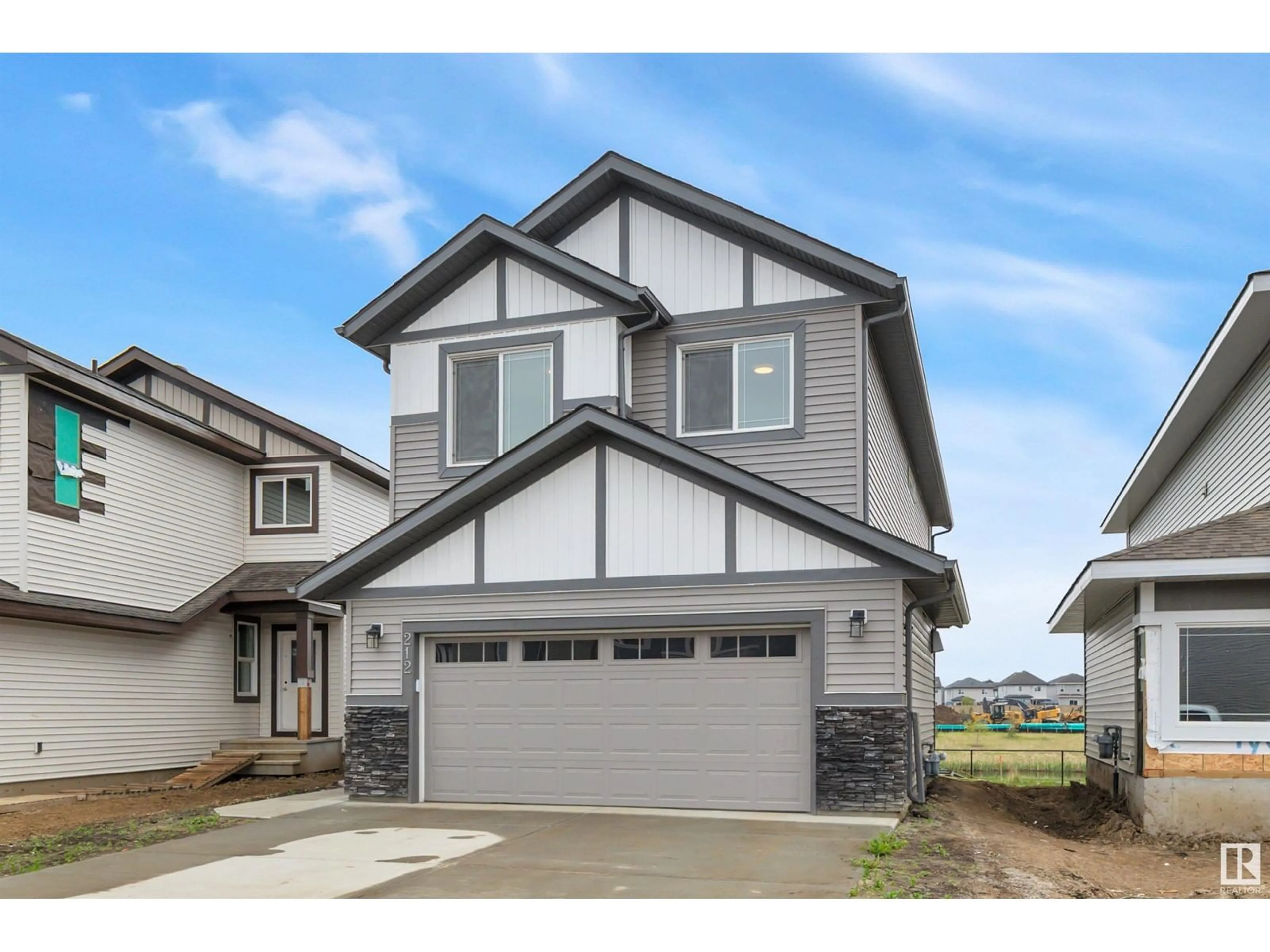 Home with vinyl exterior material, street for 212 CALEDON CR, Spruce Grove Alberta T7X0Y6