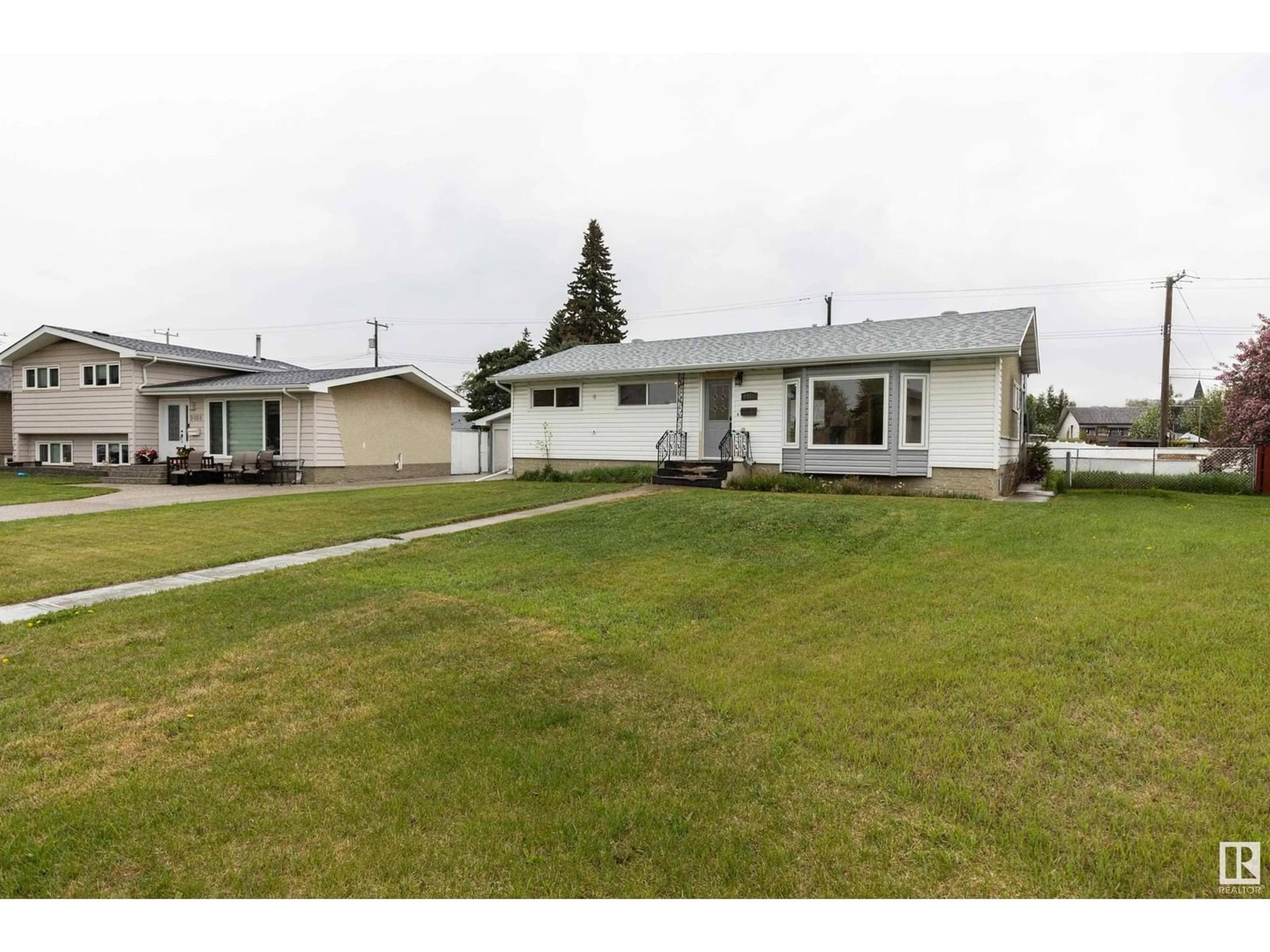 A pic from outside/outdoor area/front of a property/back of a property/a pic from drone, street for 9104 130 AV, Edmonton Alberta T5E0S2