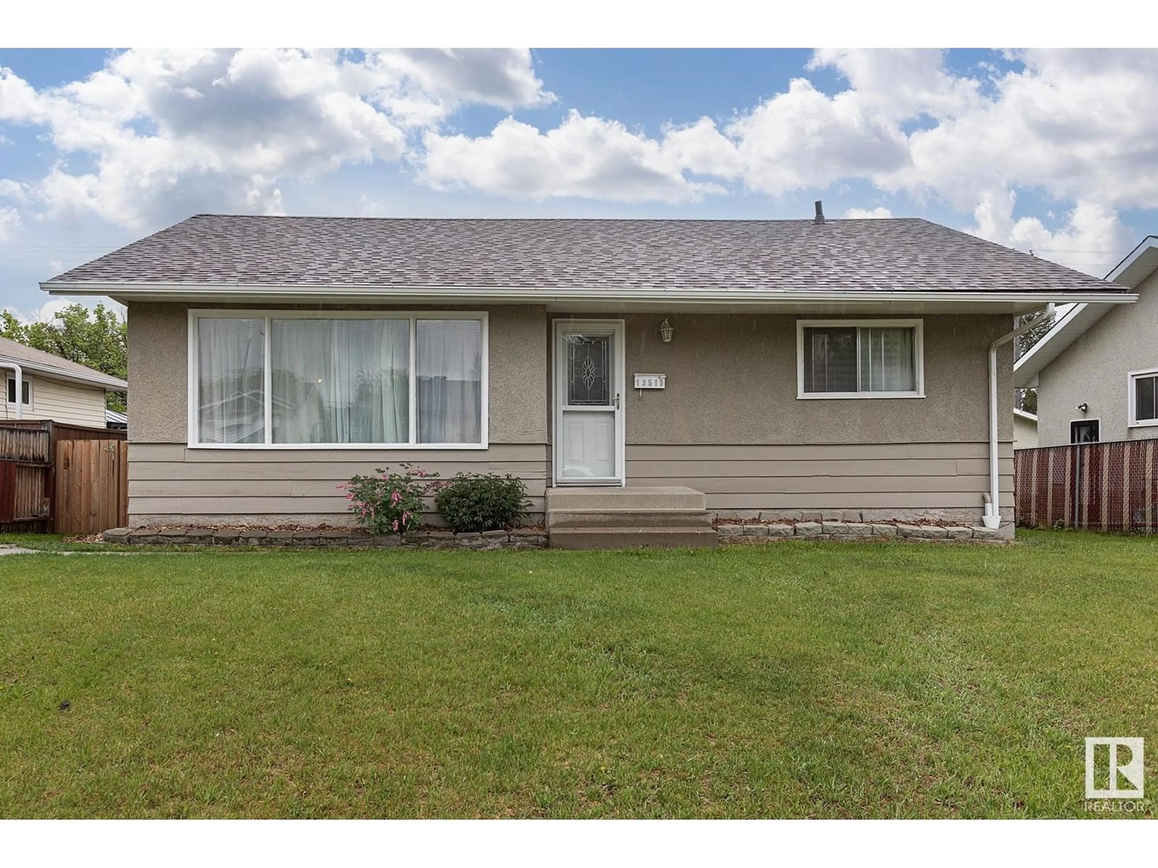 Home with vinyl exterior material, street for 13519 108 ST, Edmonton Alberta T5E4X7