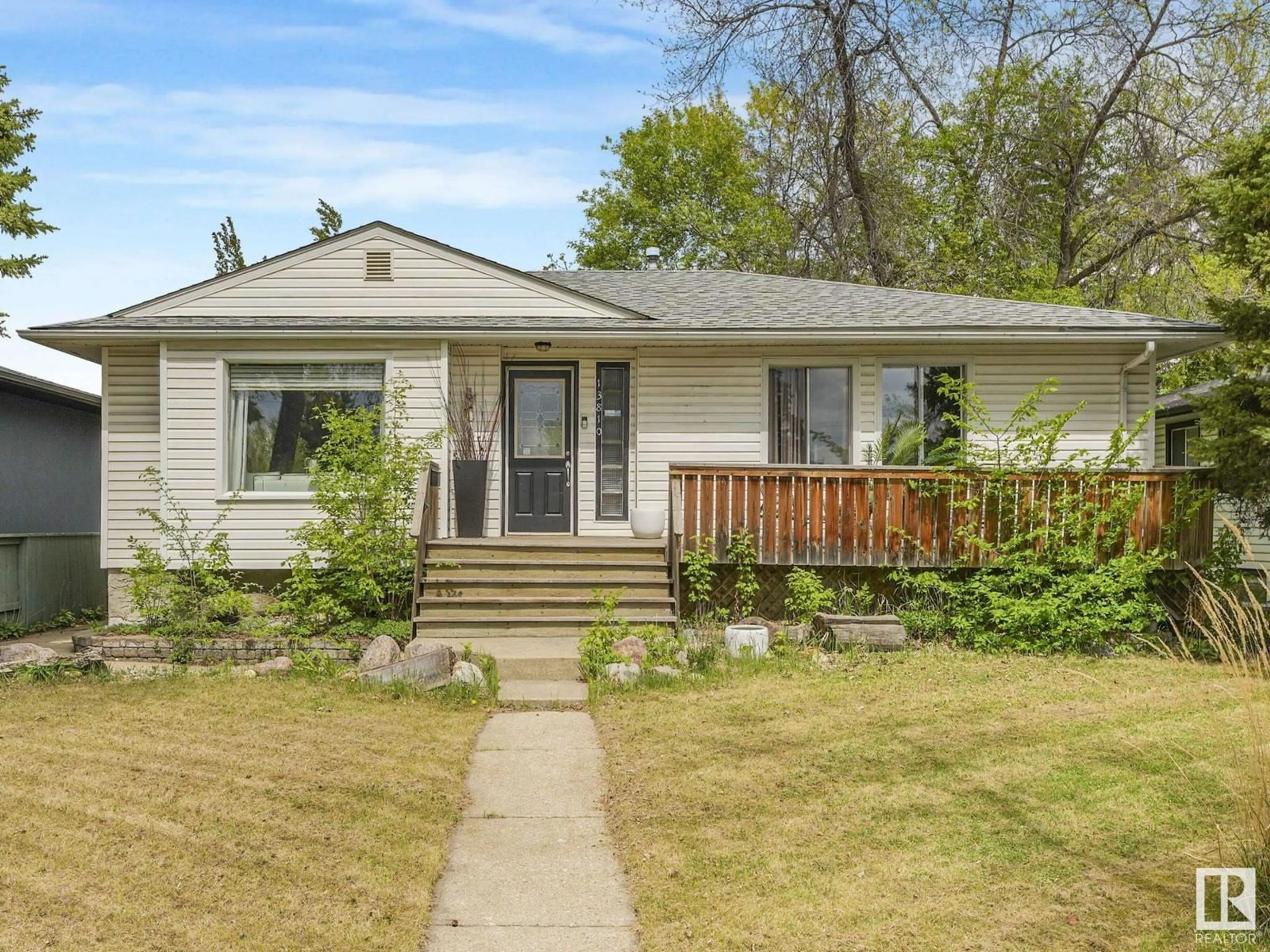 Home with vinyl exterior material, street for 13810 102 AV, Edmonton Alberta T5N0P3