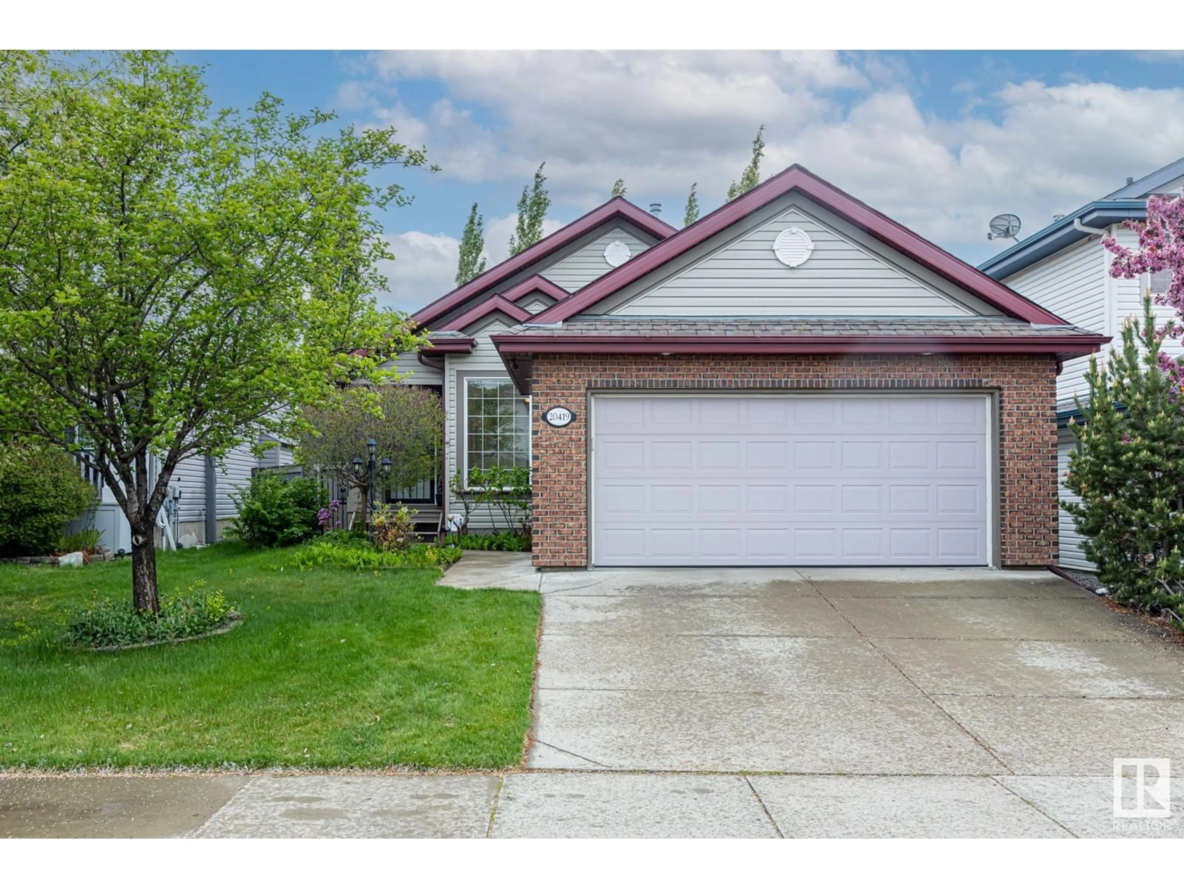 Home with brick exterior material, street for 20419 60 AV, Edmonton Alberta T6M2Z5