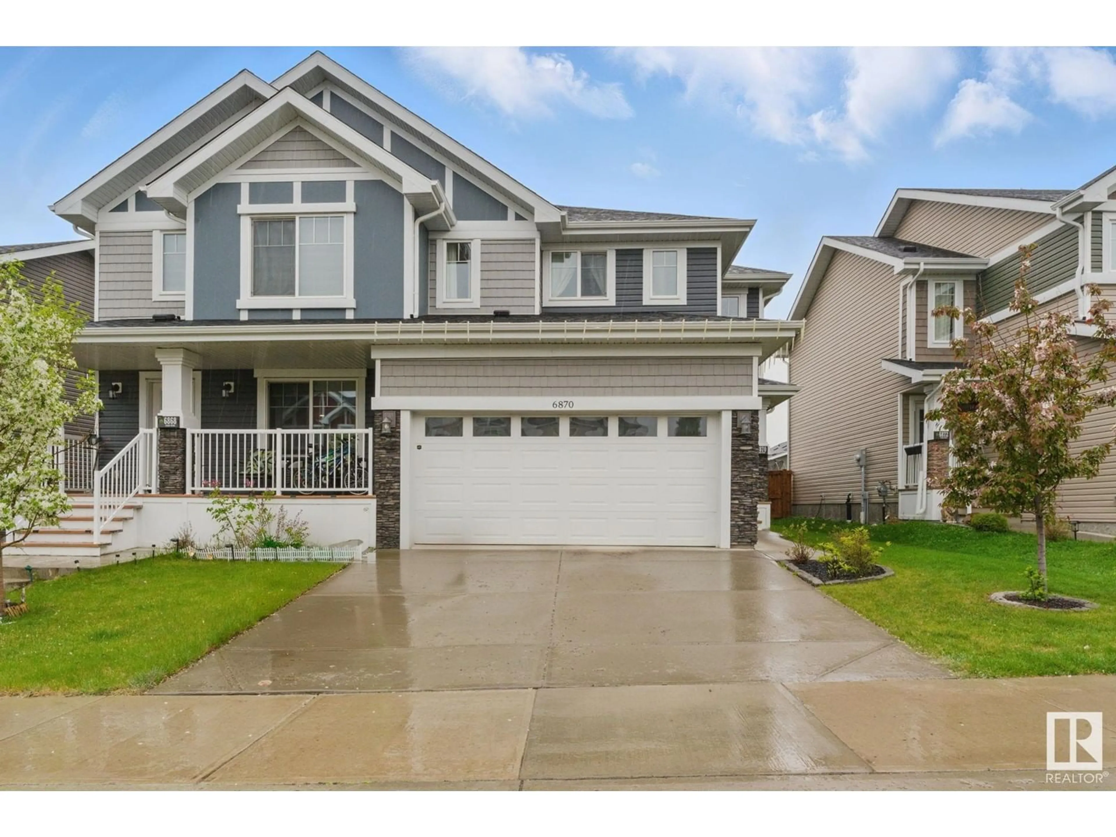 Home with vinyl exterior material, street for NW - 6870 EVANS WD, Edmonton Alberta T6M0T8