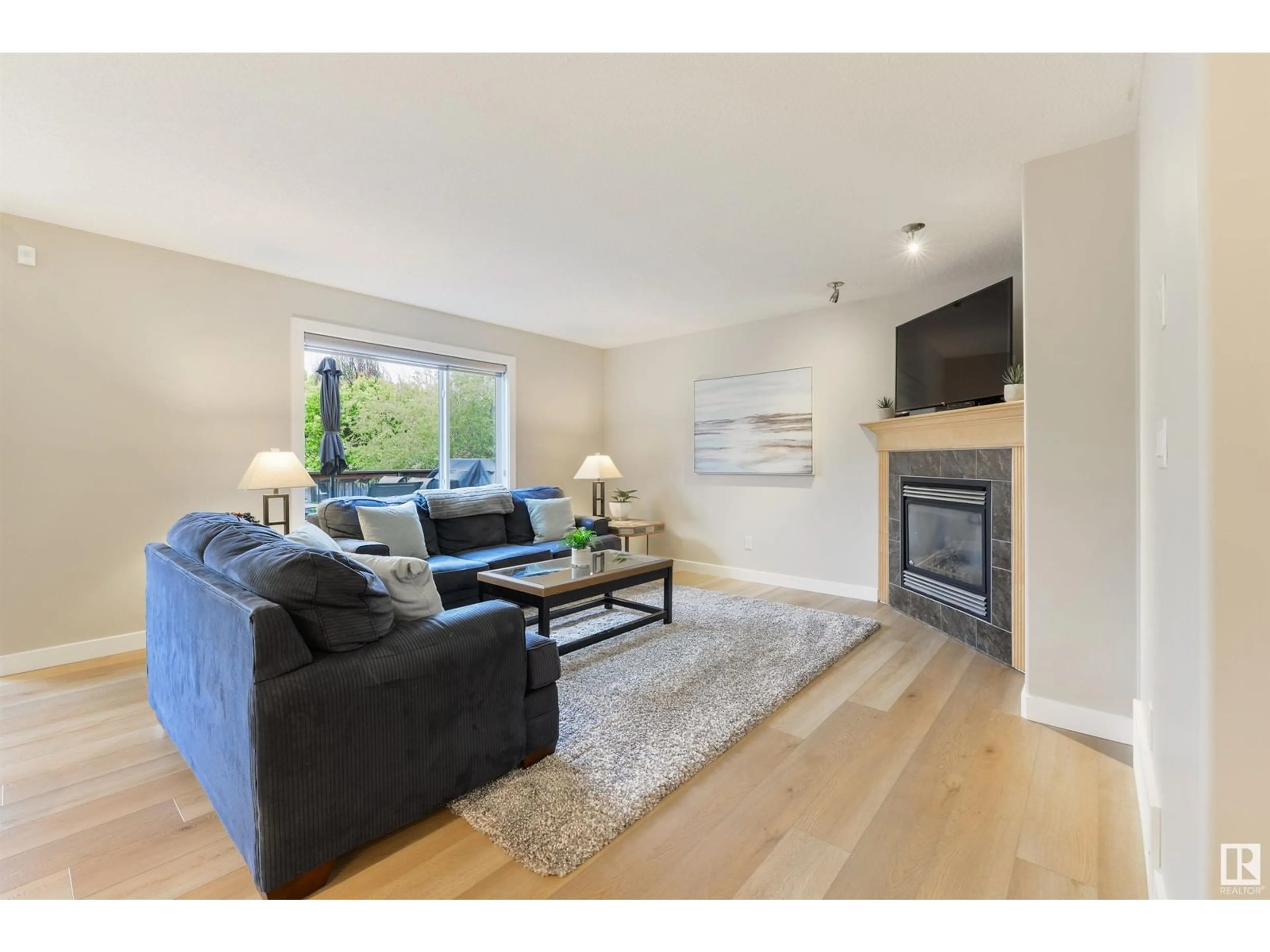 Living room with furniture, wood/laminate floor for 84 AVONLEA WY, Spruce Grove Alberta T7X4R5