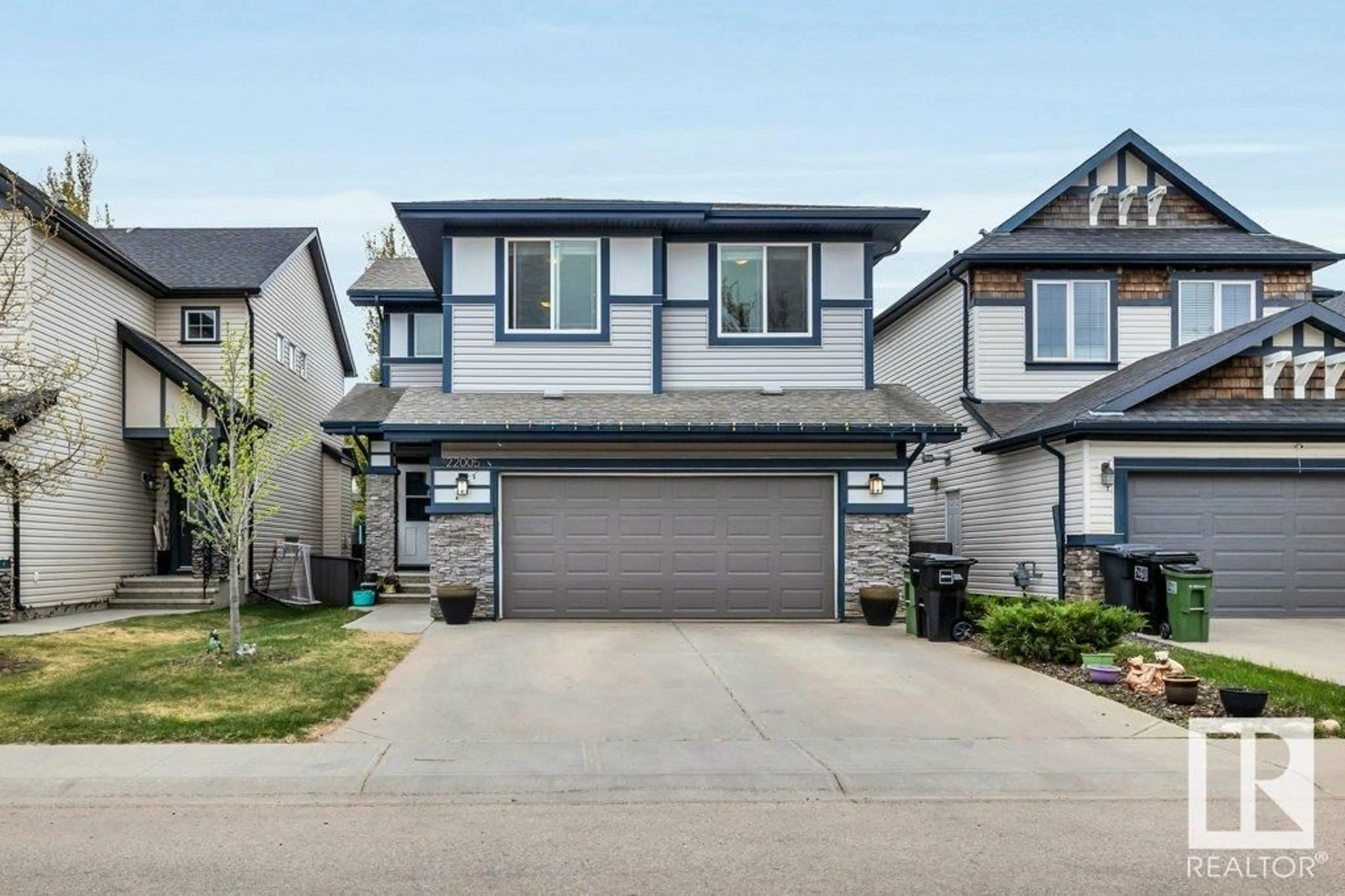 Home with vinyl exterior material, street for 22005 95A AV, Edmonton Alberta T5T4A9