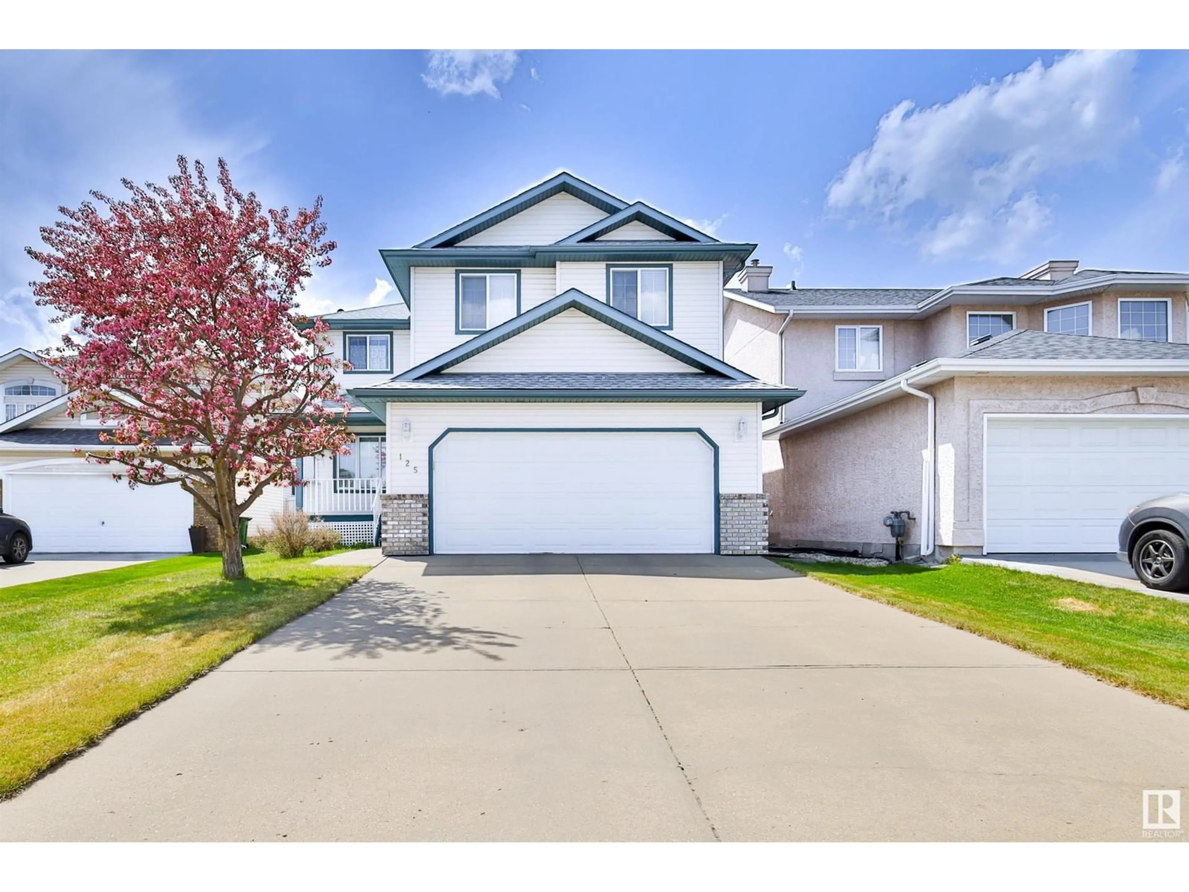 Home with vinyl exterior material, street for 125 DECHENE RD NW, Edmonton Alberta T6M2N1