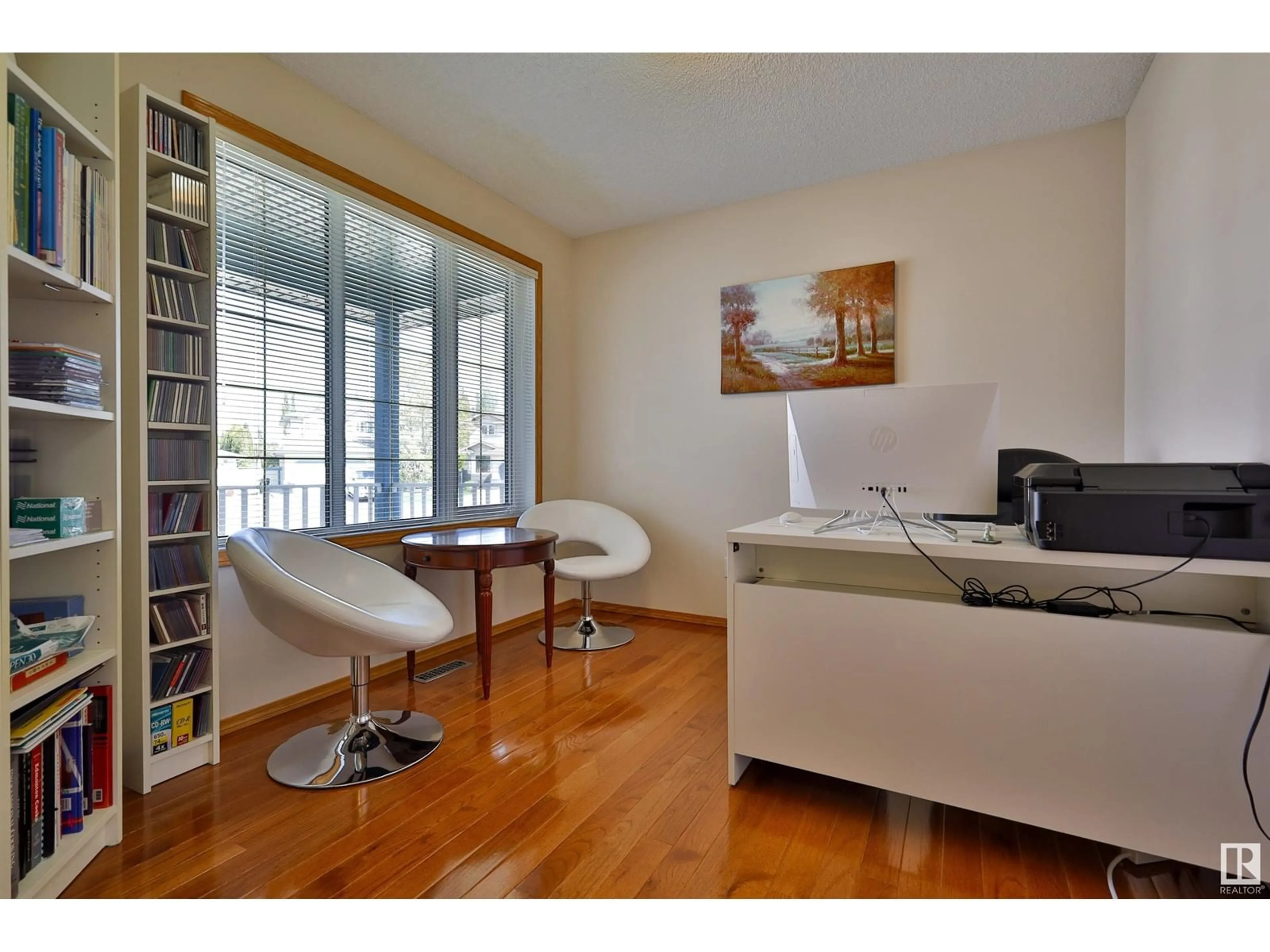 Living room with furniture, wood/laminate floor for 125 DECHENE RD NW, Edmonton Alberta T6M2N1
