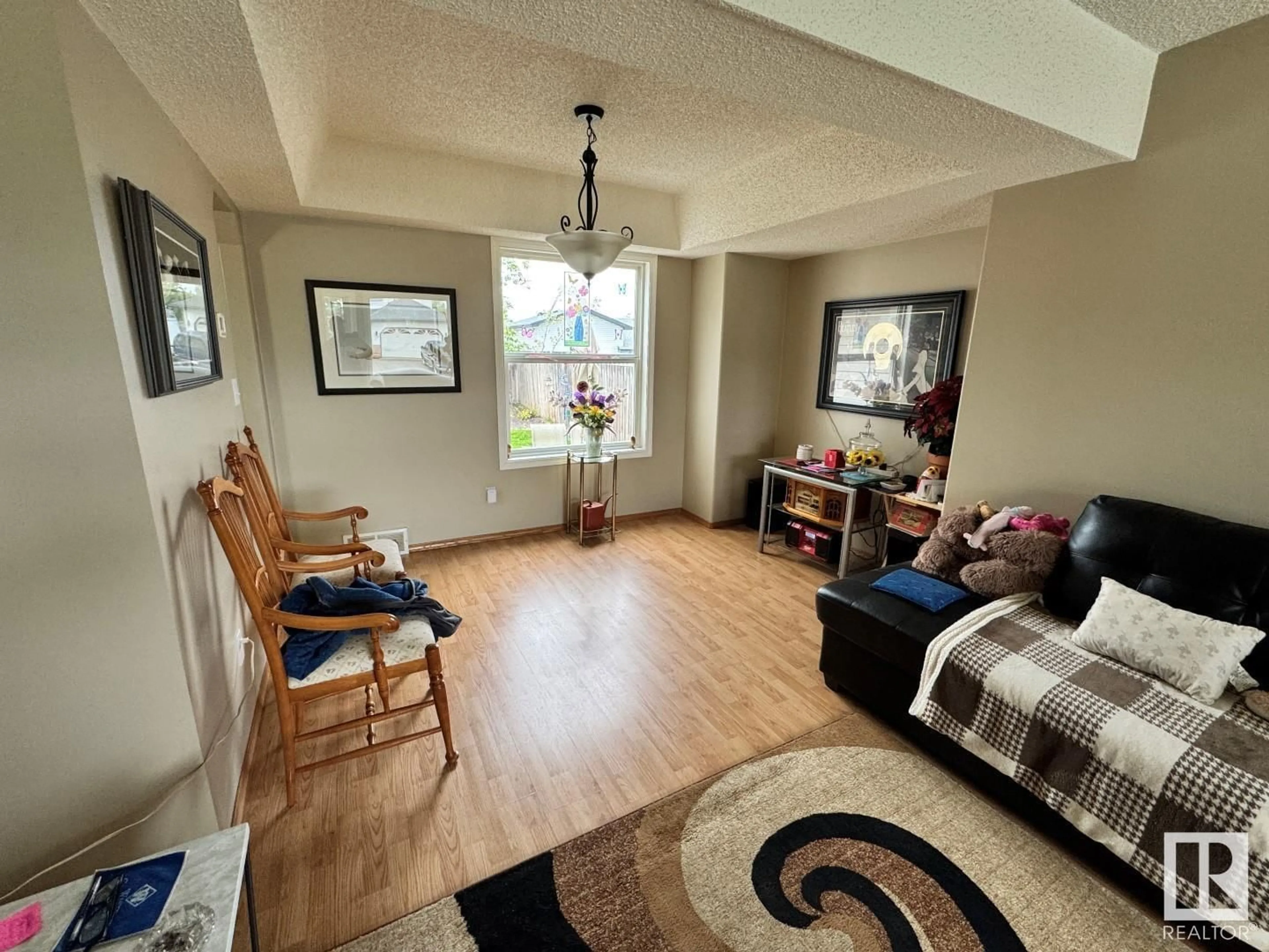 Living room with furniture, wood/laminate floor for 614 JENNER COVE CV, Edmonton Alberta T6L6R1