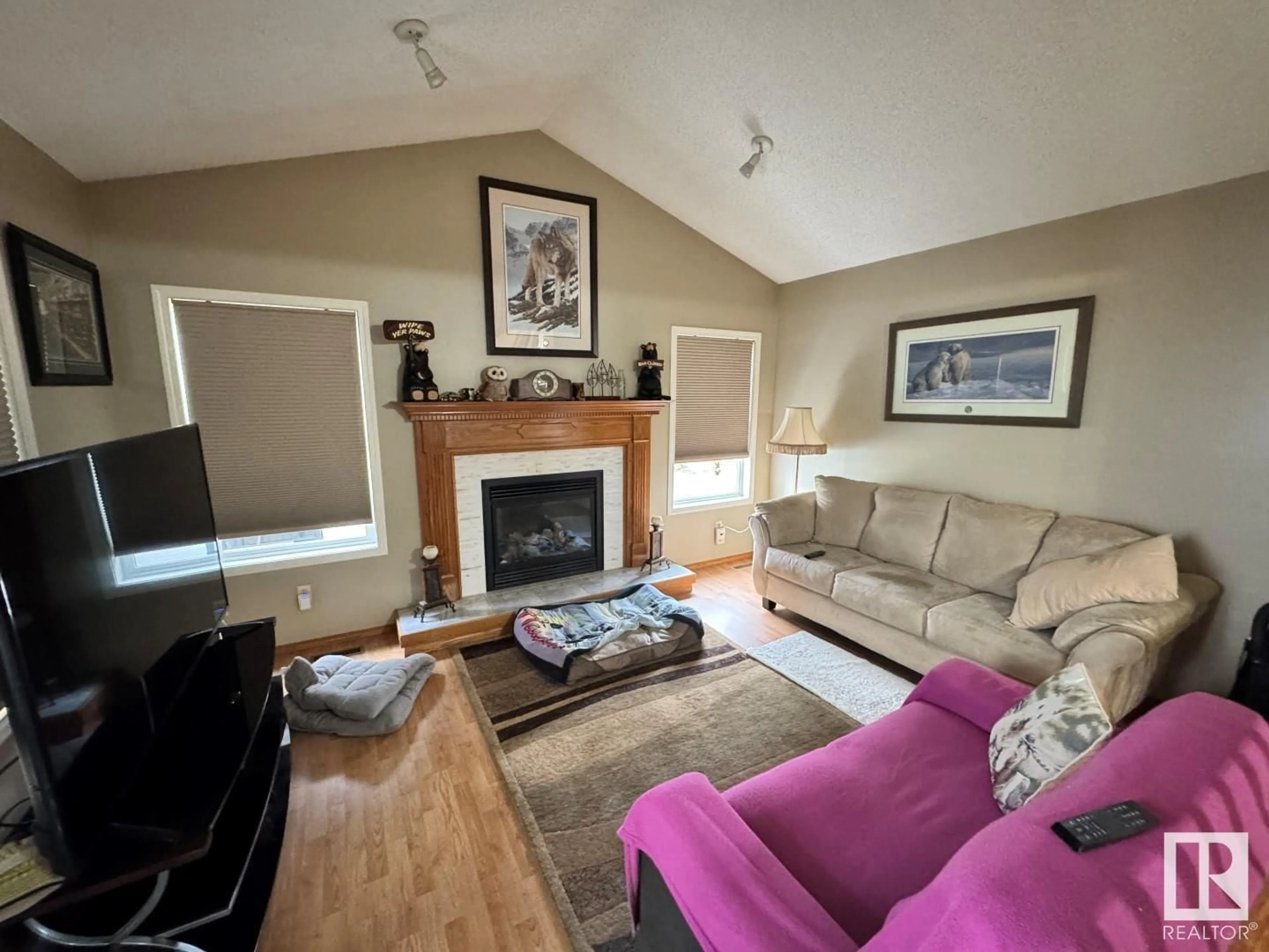Living room with furniture, wood/laminate floor for 614 JENNER COVE CV, Edmonton Alberta T6L6R1