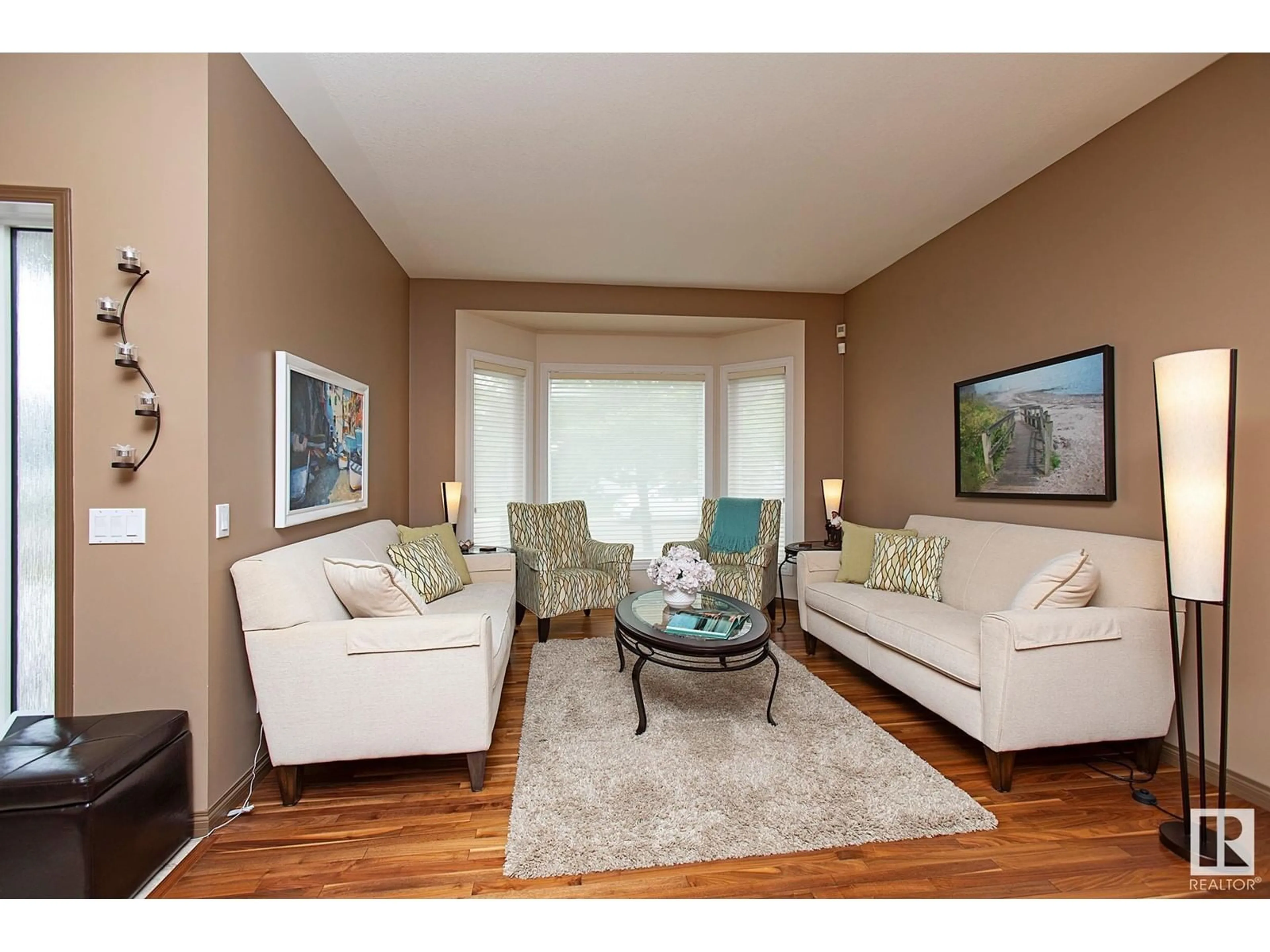 Living room with furniture, wood/laminate floor for 8815 188 STREET, Edmonton Alberta T5T5Z8