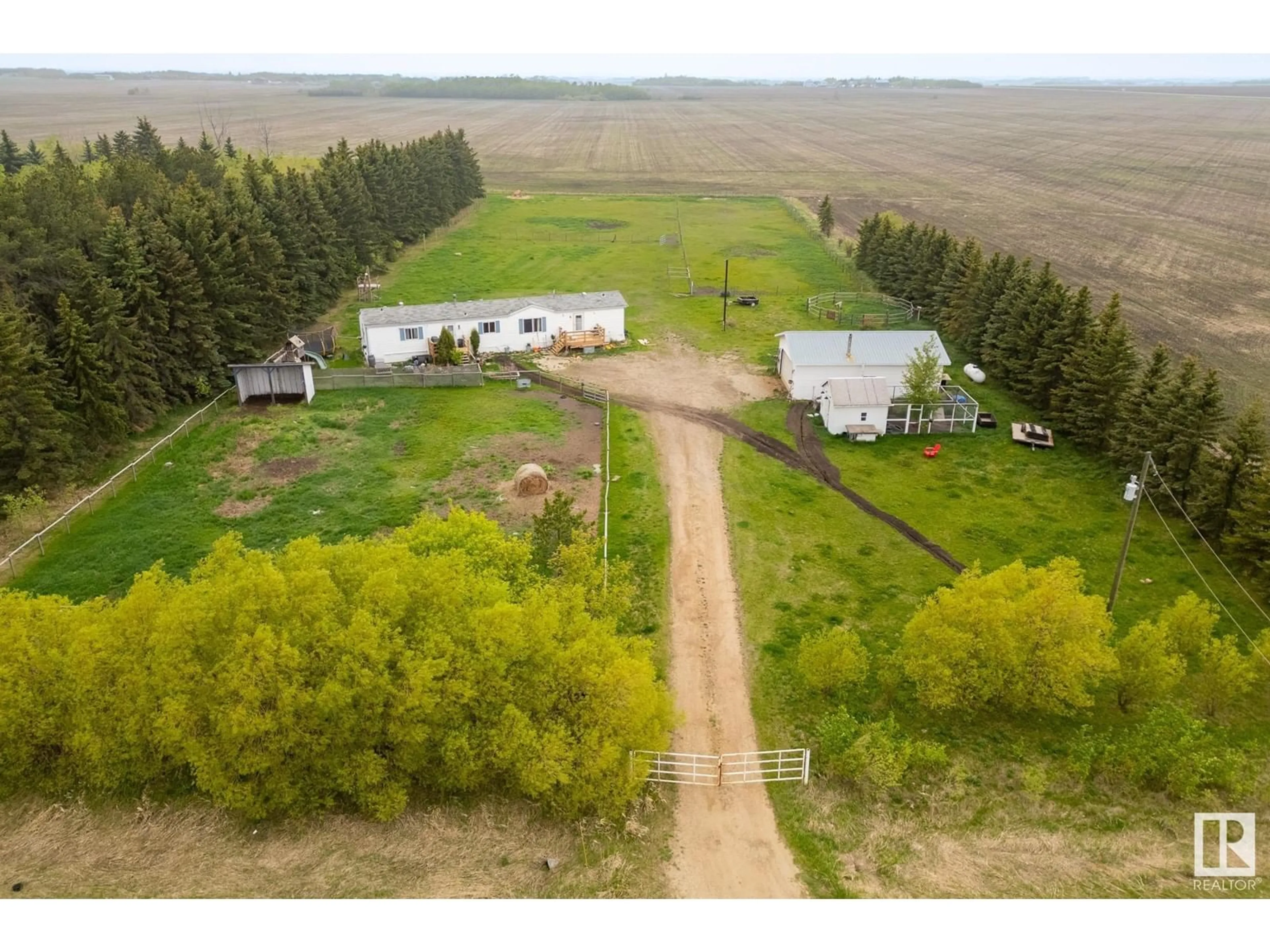 A pic from outside/outdoor area/front of a property/back of a property/a pic from drone, forest/trees view for 55524 RGE ROAD 261, Rural Sturgeon County Alberta T8R1P4