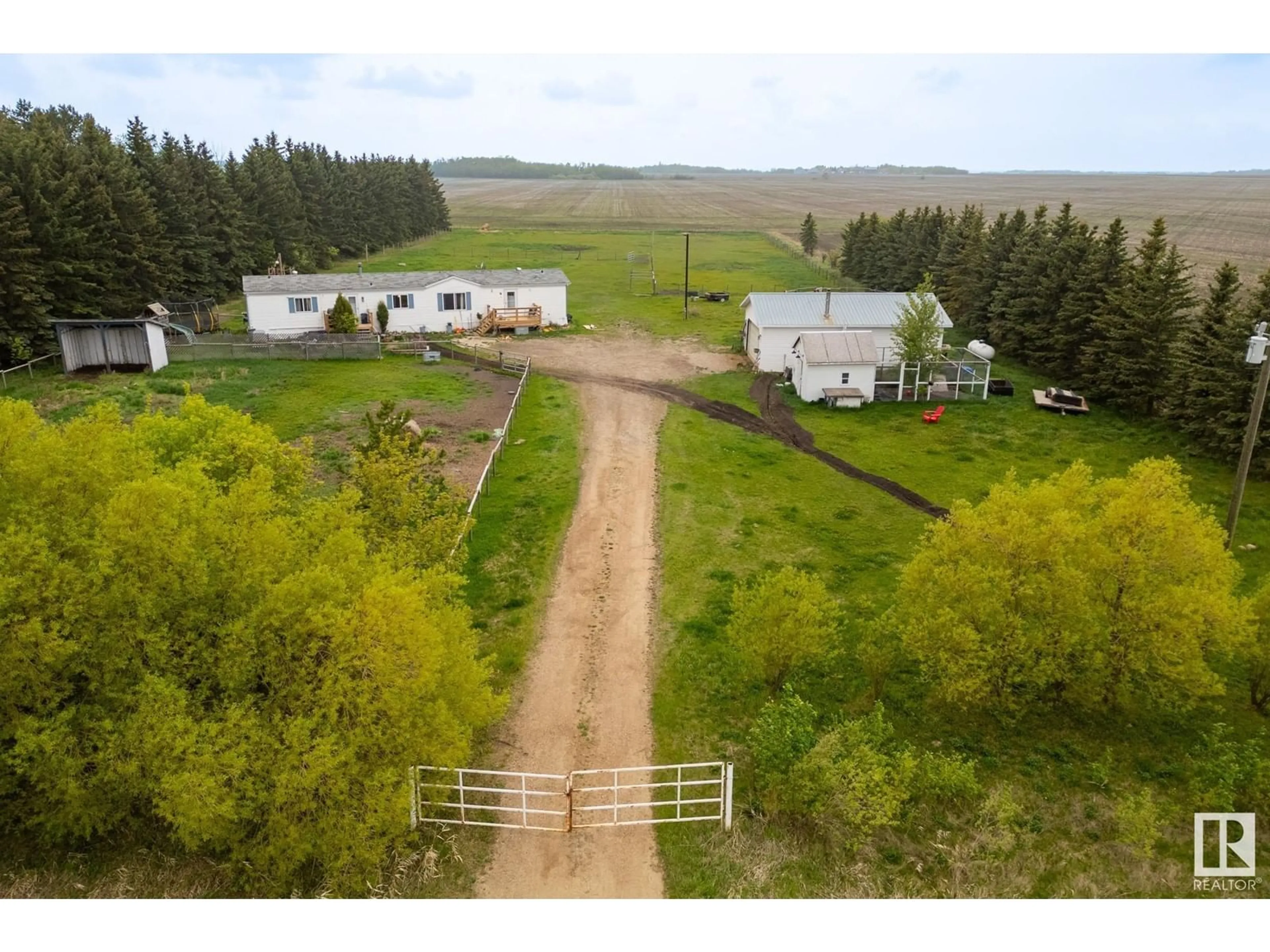 A pic from outside/outdoor area/front of a property/back of a property/a pic from drone, forest/trees view for 55524 RGE ROAD 261, Rural Sturgeon County Alberta T8R1P4