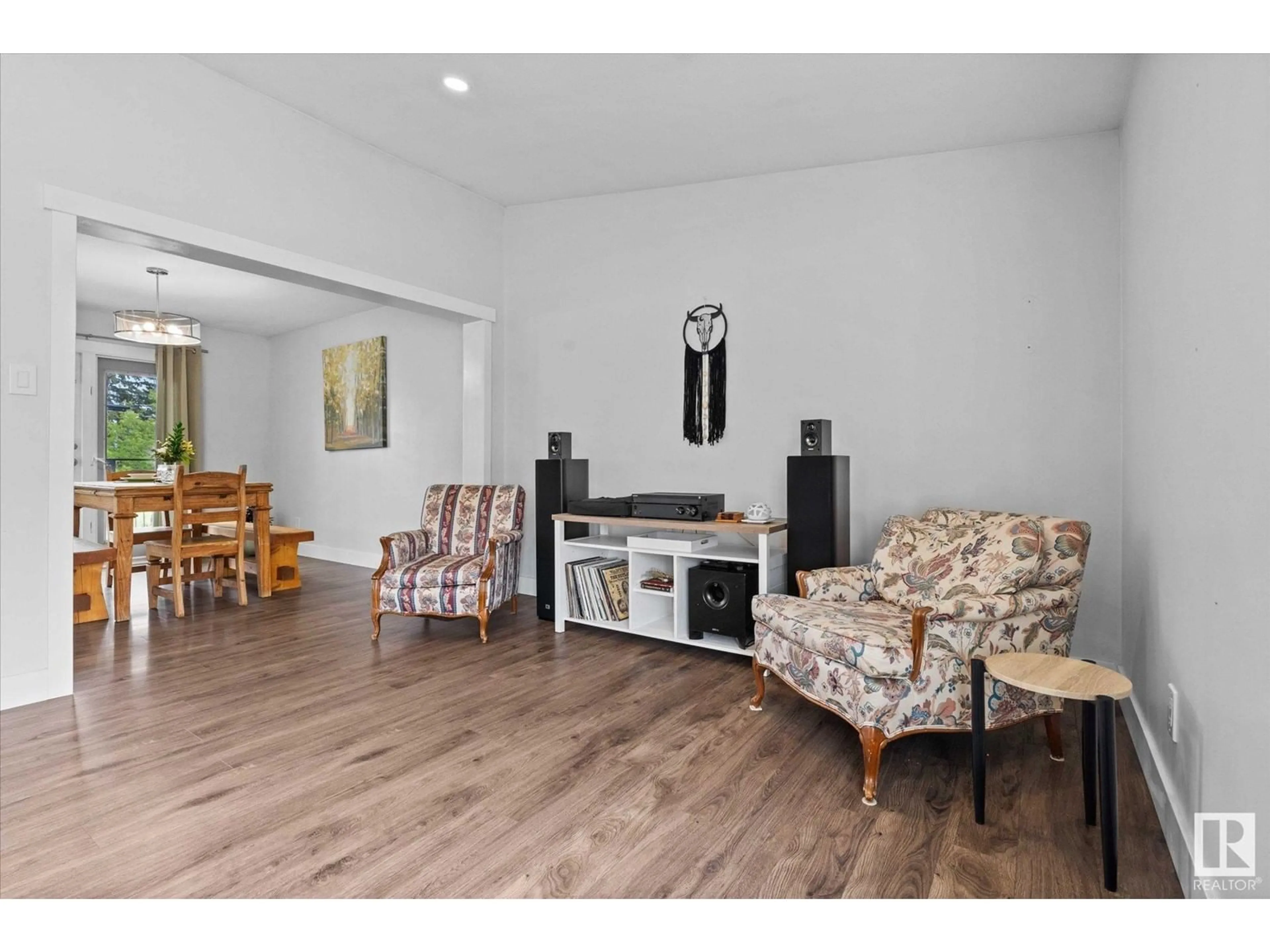 Living room with furniture, wood/laminate floor for 4920 47 AV, Evansburg Alberta T0E0T0
