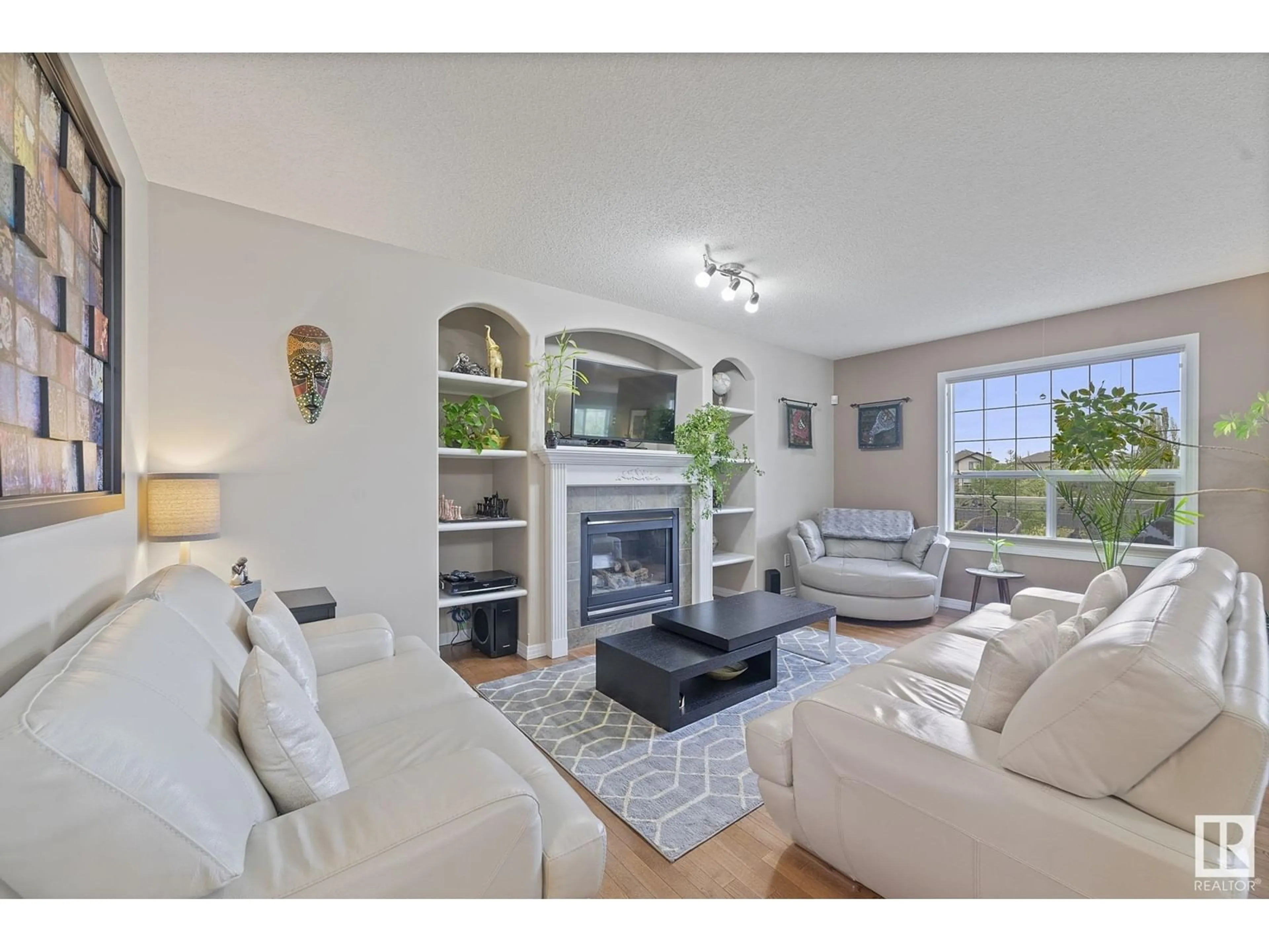 Living room with furniture, unknown for 8214 6 AV SW, Edmonton Alberta T6X1L6