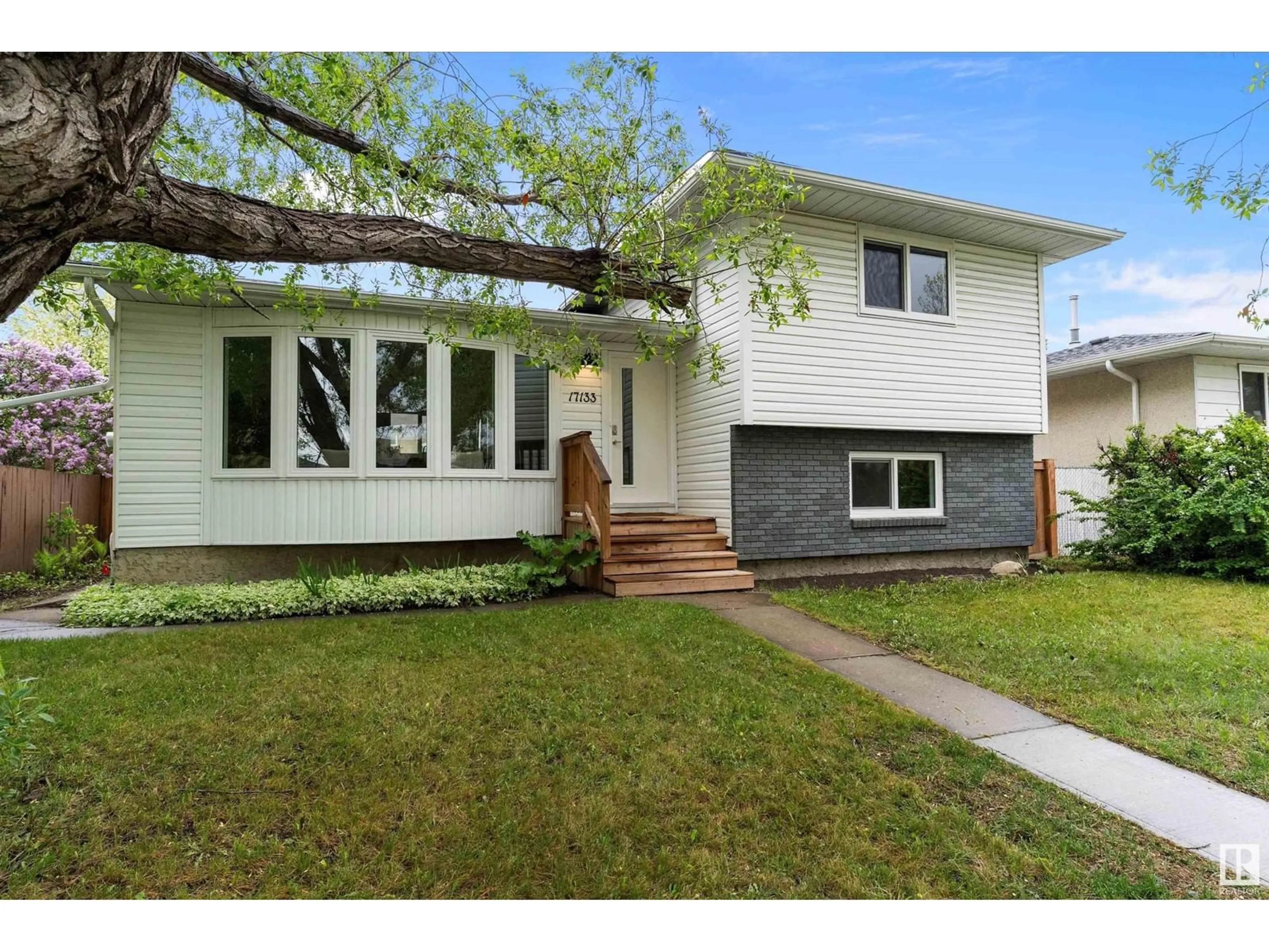 Home with vinyl exterior material, street for 17133 100 ST, Edmonton Alberta T5X3R6