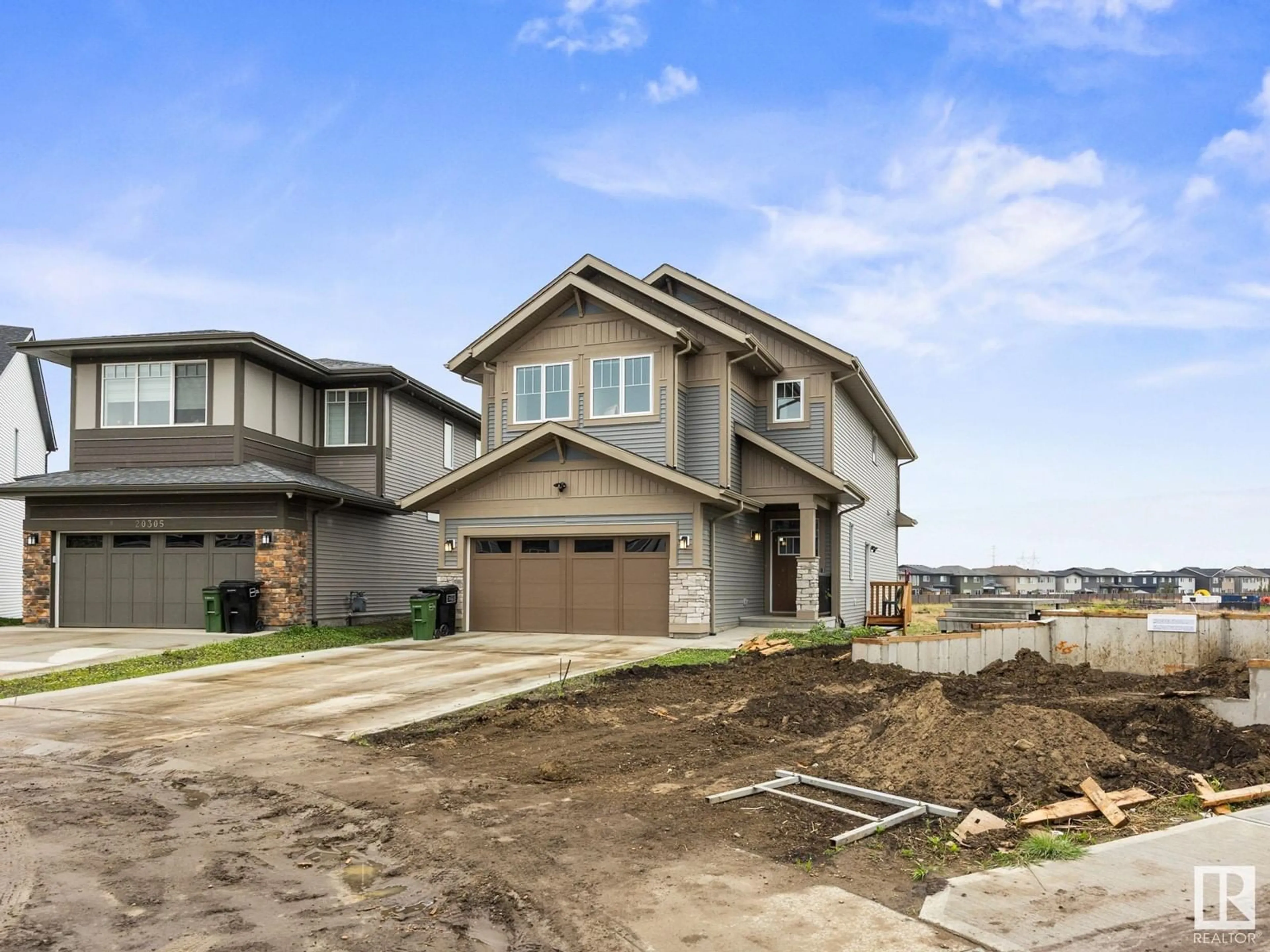 Home with brick exterior material, street for 20309 25A AV, Edmonton Alberta T6M1N8