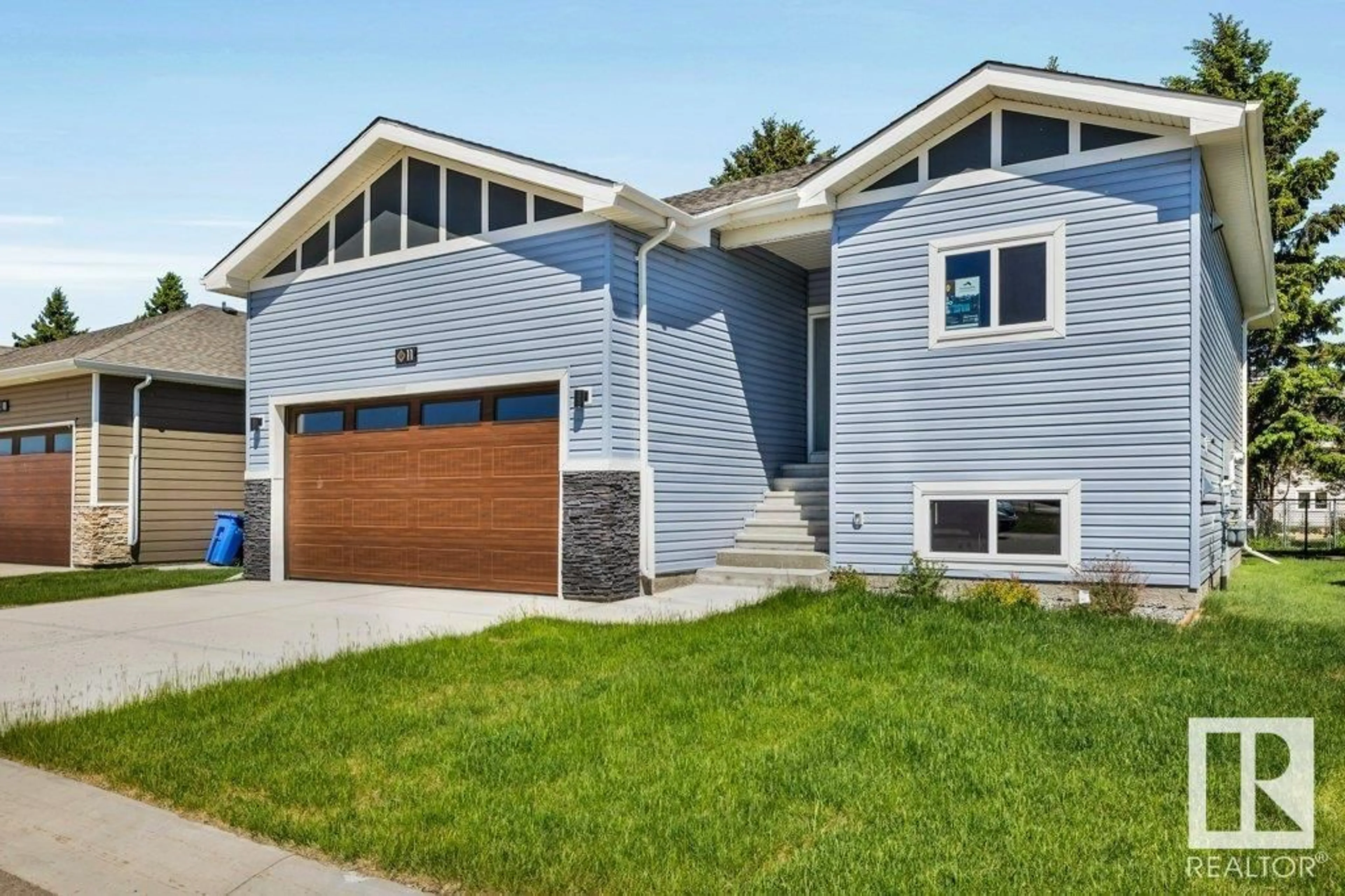 Home with vinyl exterior material, street for 11 - 6519 46 ST, Wetaskiwin Alberta T9A1Y5
