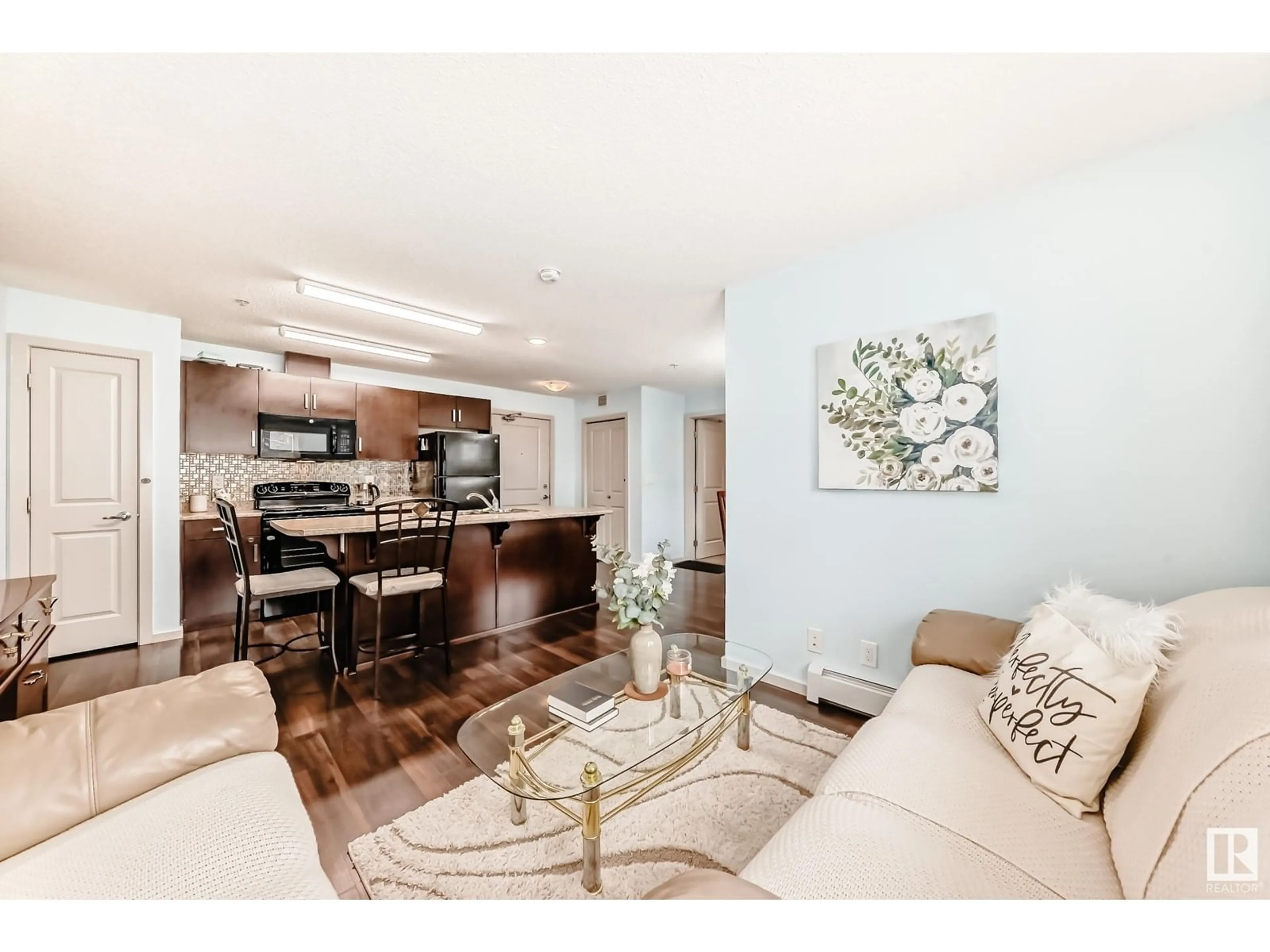 Living room with furniture, wood/laminate floor for #122 - 5515 7 AV, Edmonton Alberta T6X2A8