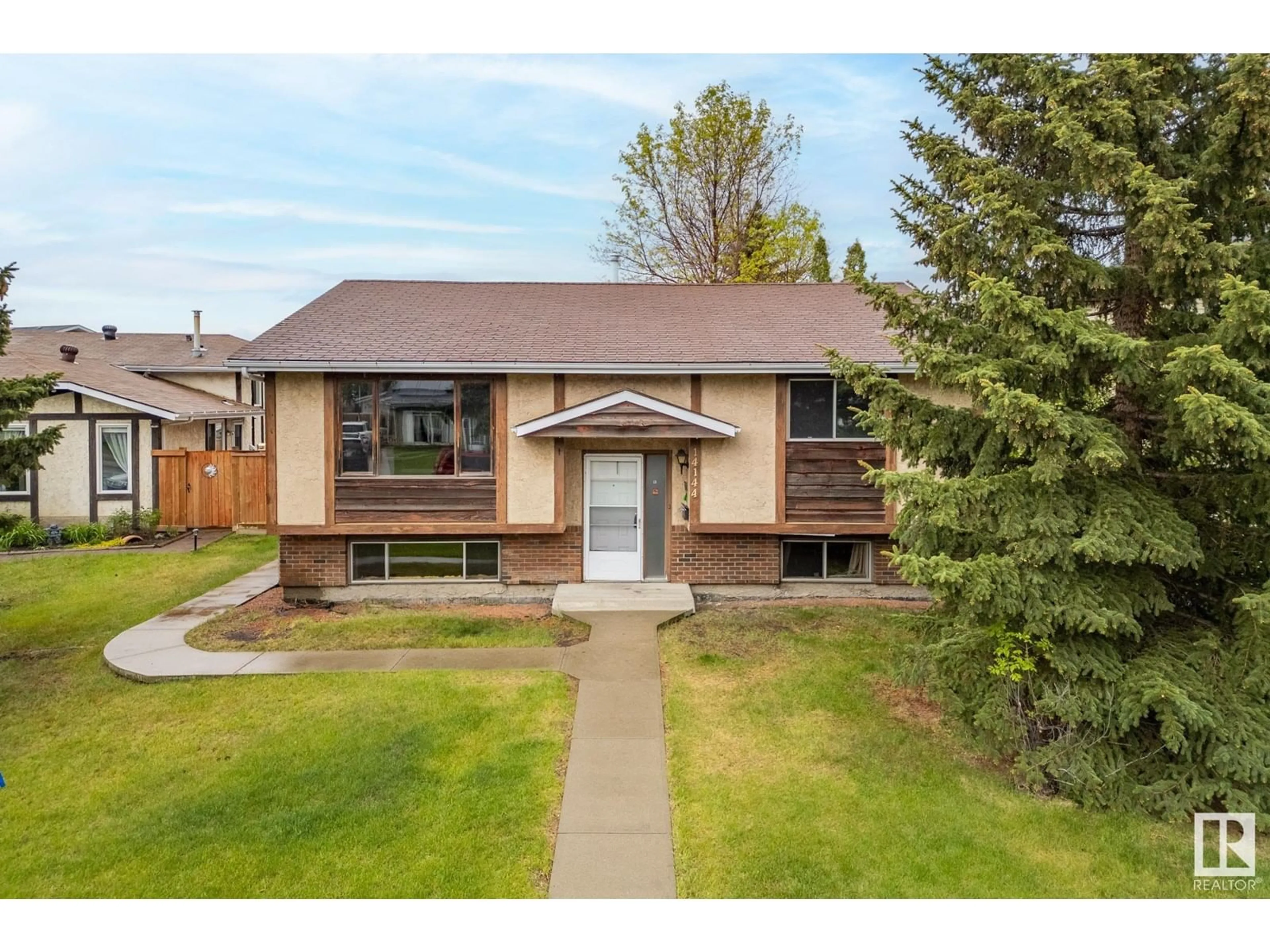 Home with brick exterior material, street for NW - 14144 26 ST, Edmonton Alberta T5Y1G9