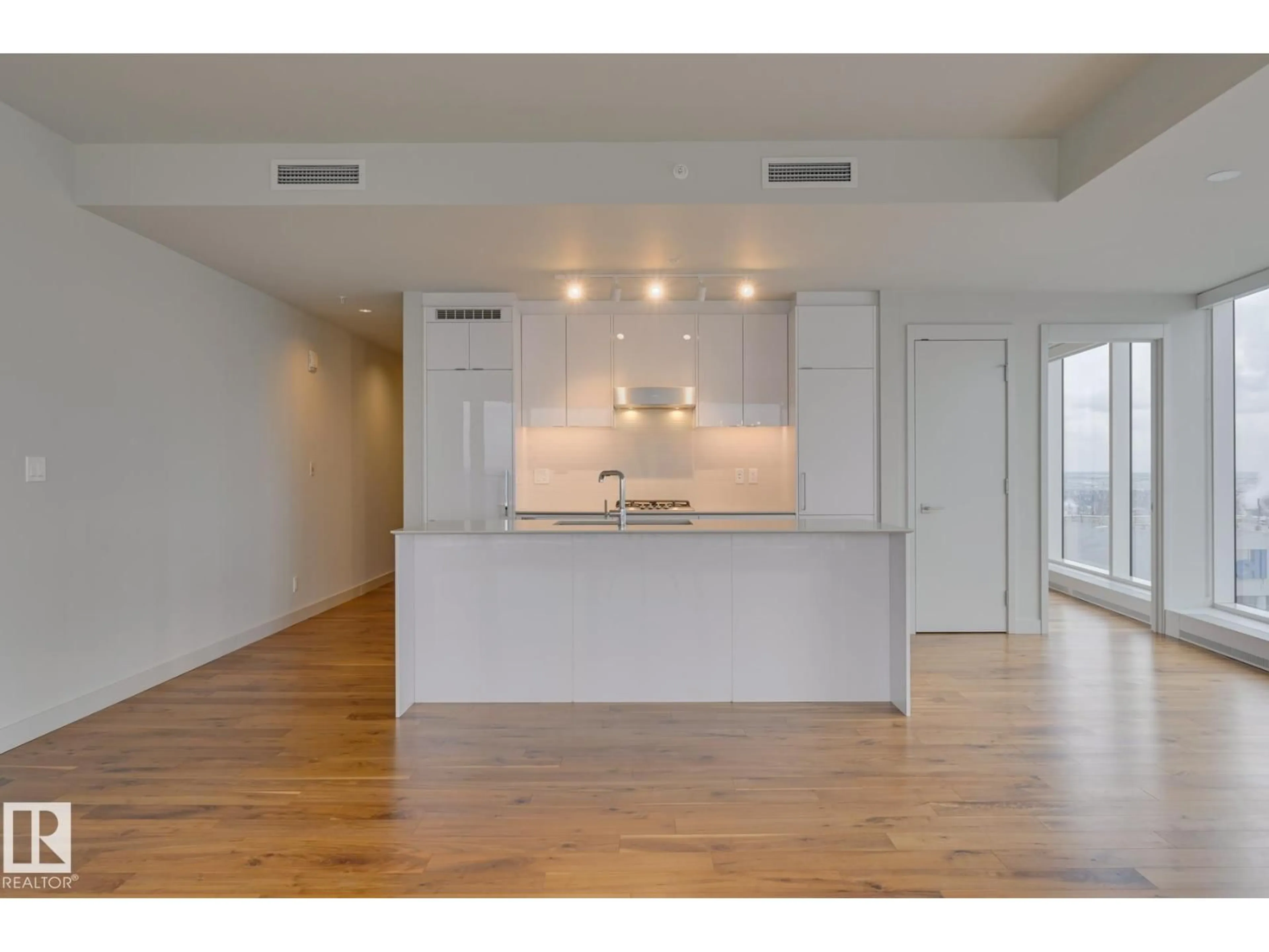 Open concept kitchen, wood/laminate floor for 10360 - 4106 102 ST NW, Edmonton Alberta T5J0K6