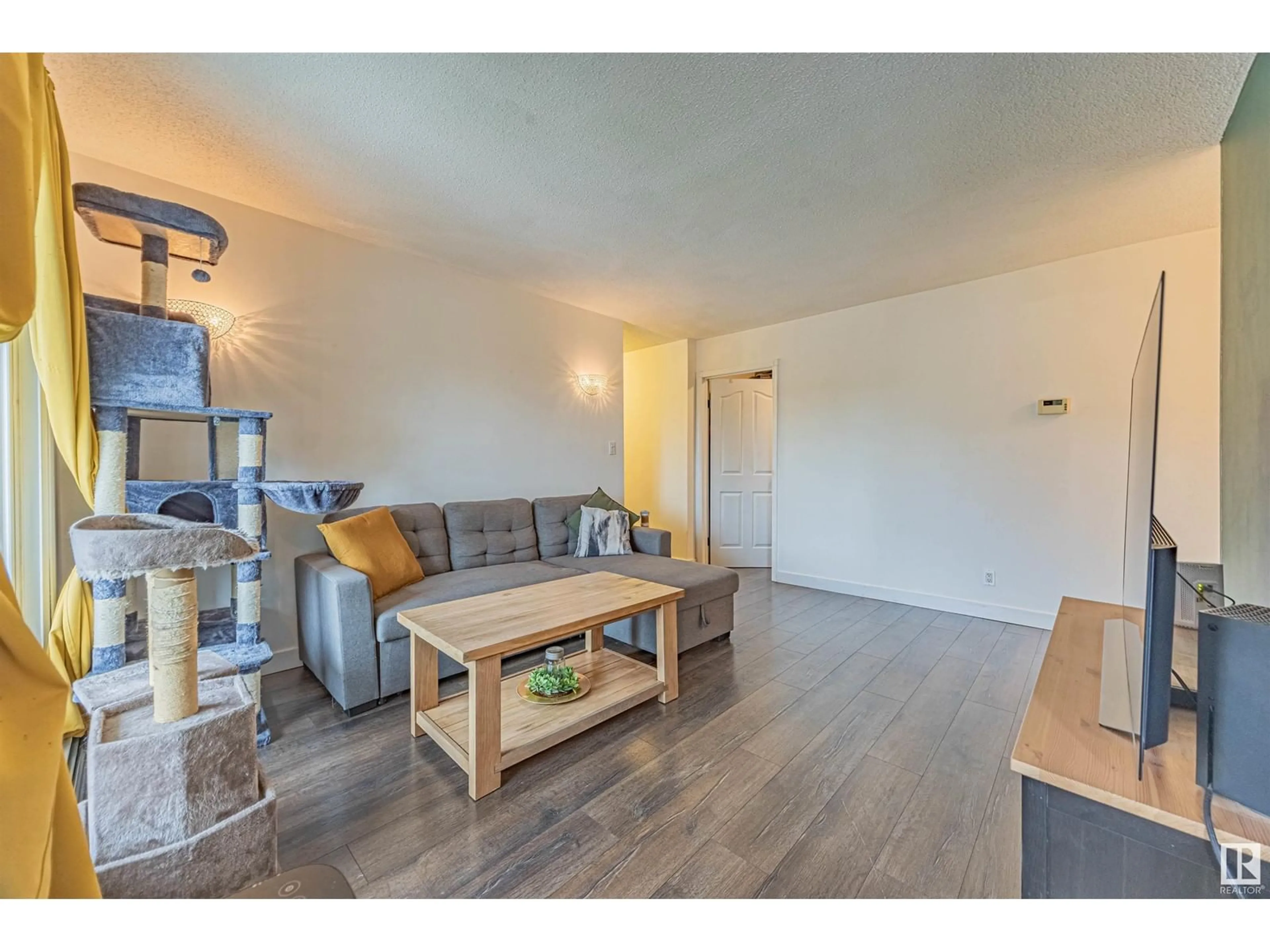 Living room with furniture, wood/laminate floor for #303 - 7407 171 ST, Edmonton Alberta T5T2R1