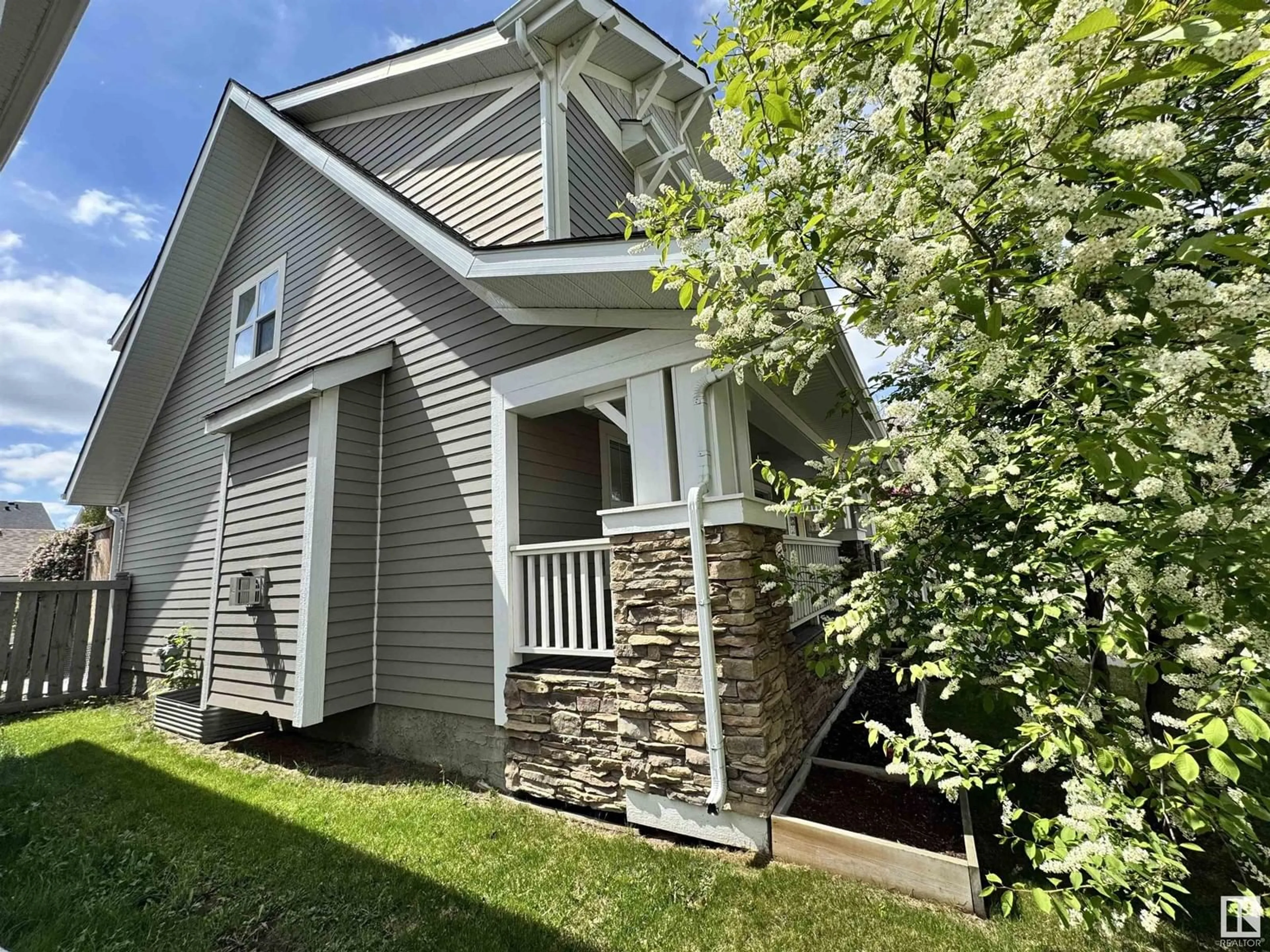 Home with vinyl exterior material, street for 9923 145 AV, Edmonton Alberta T5E6M2