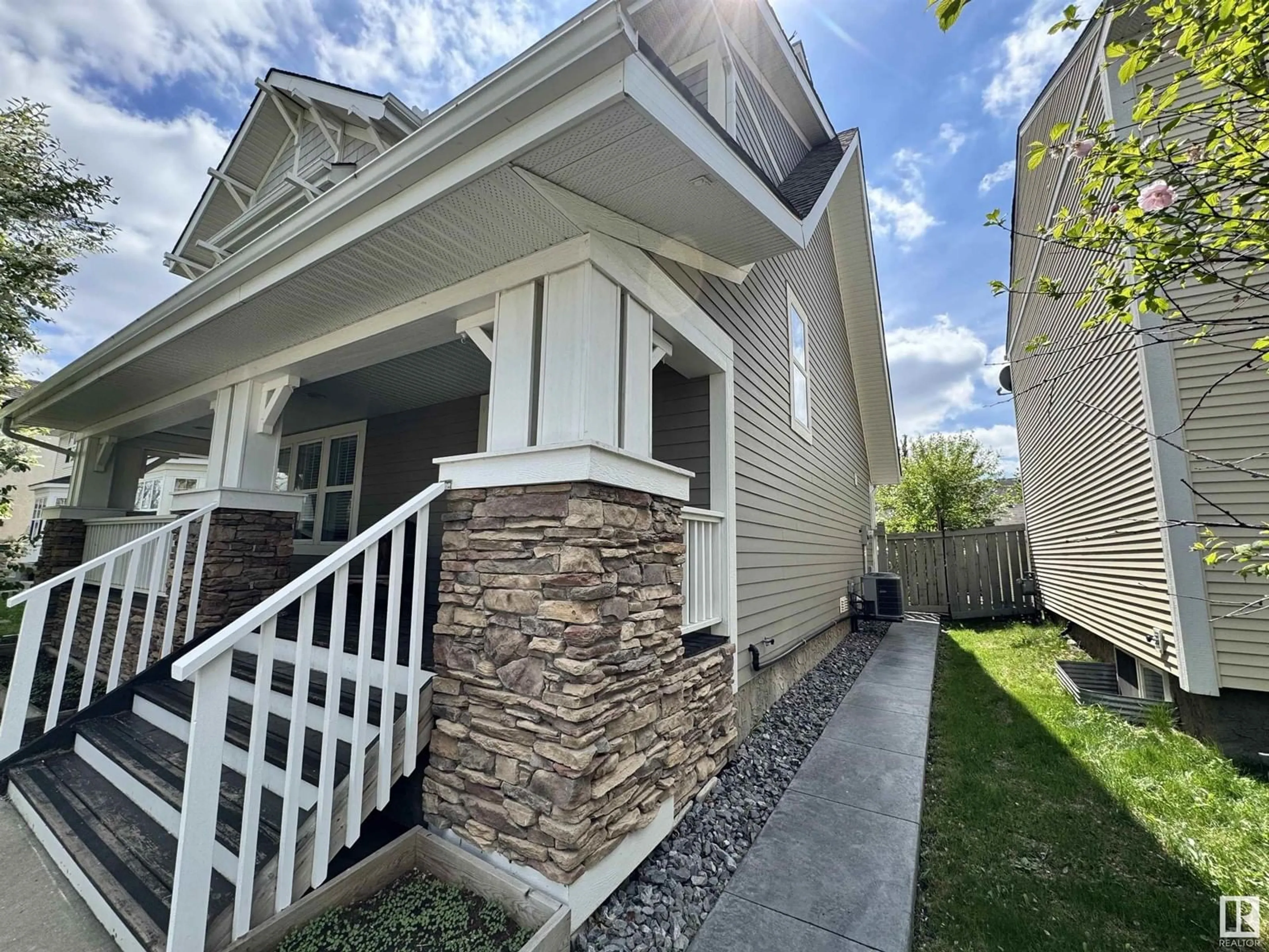 Home with vinyl exterior material, street for 9923 145 AV, Edmonton Alberta T5E6M2