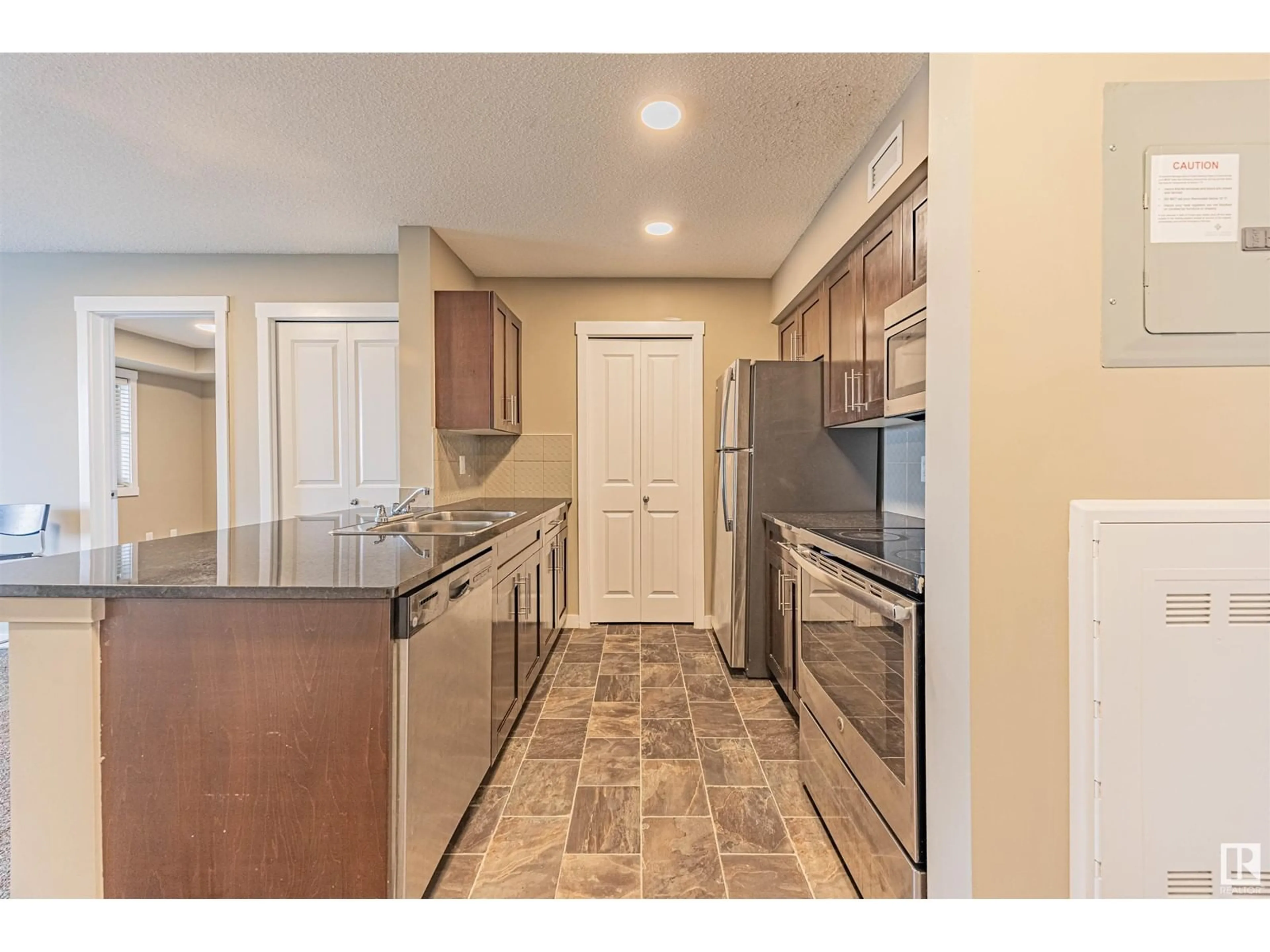 Standard kitchen, ceramic/tile floor for #415 - 5810 MULLEN PL, Edmonton Alberta T6R0W3