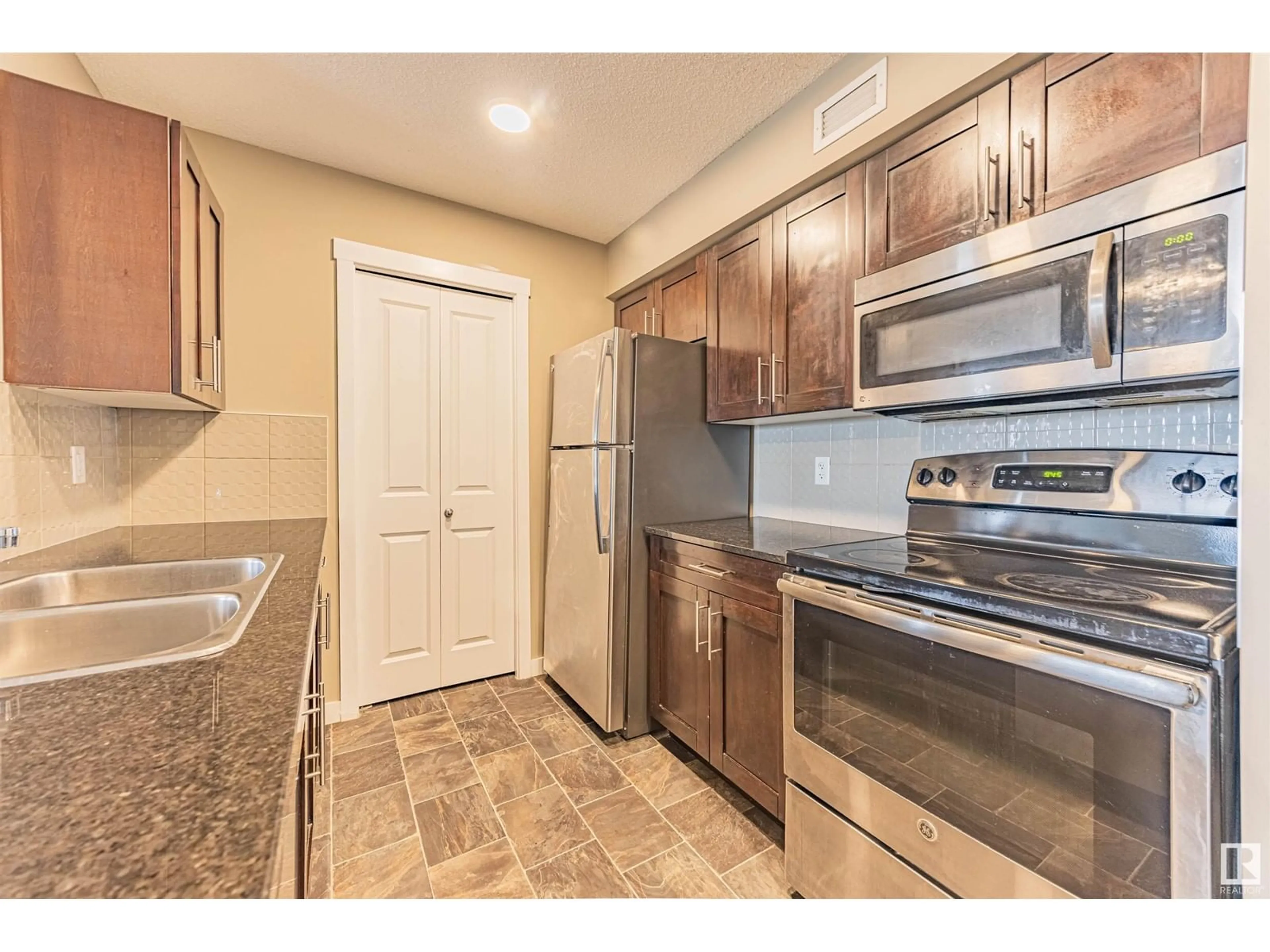 Standard kitchen, unknown for #415 - 5810 MULLEN PL, Edmonton Alberta T6R0W3