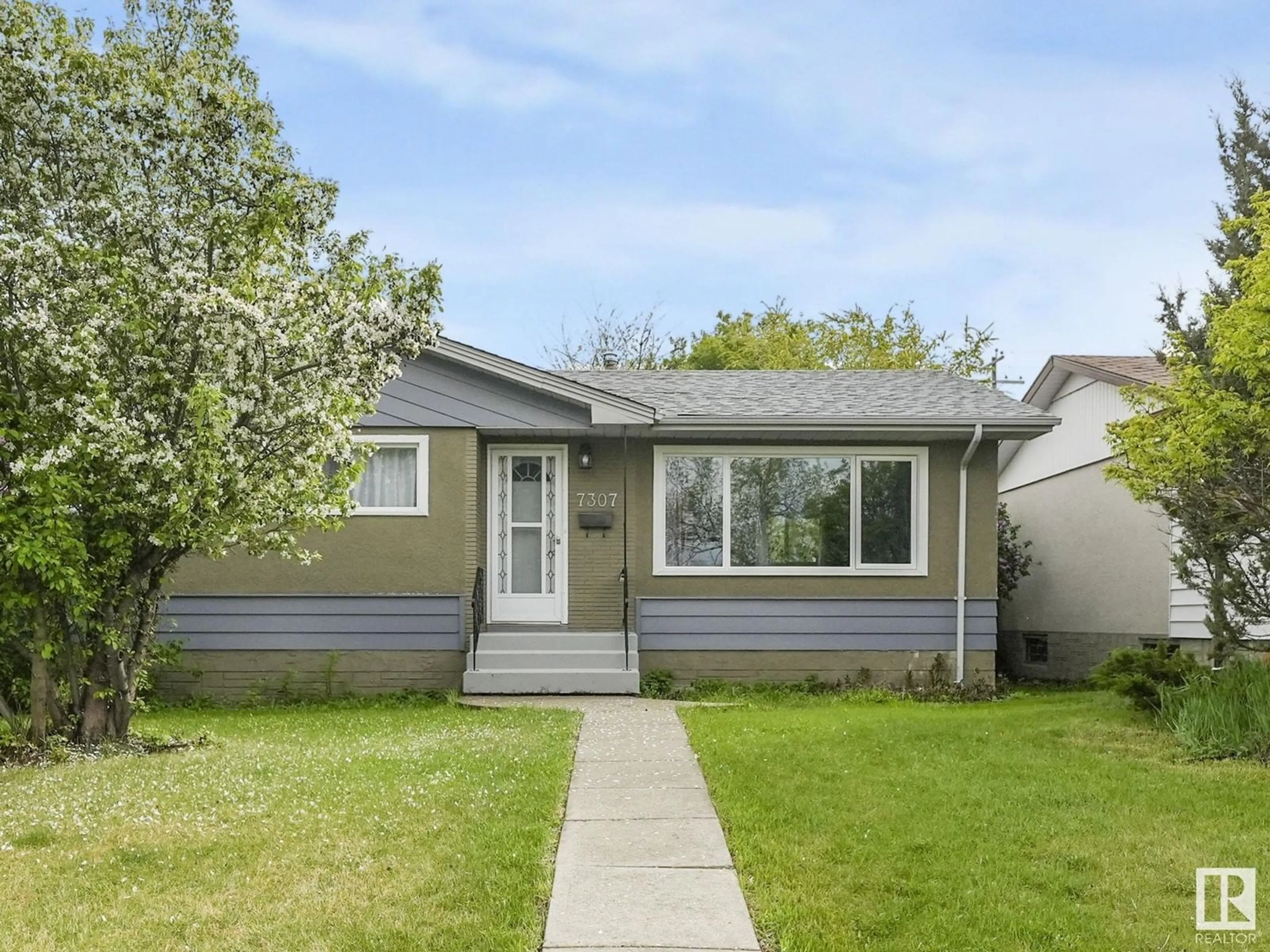 Home with vinyl exterior material, street for 7307 130A AV, Edmonton Alberta T5C1Z1