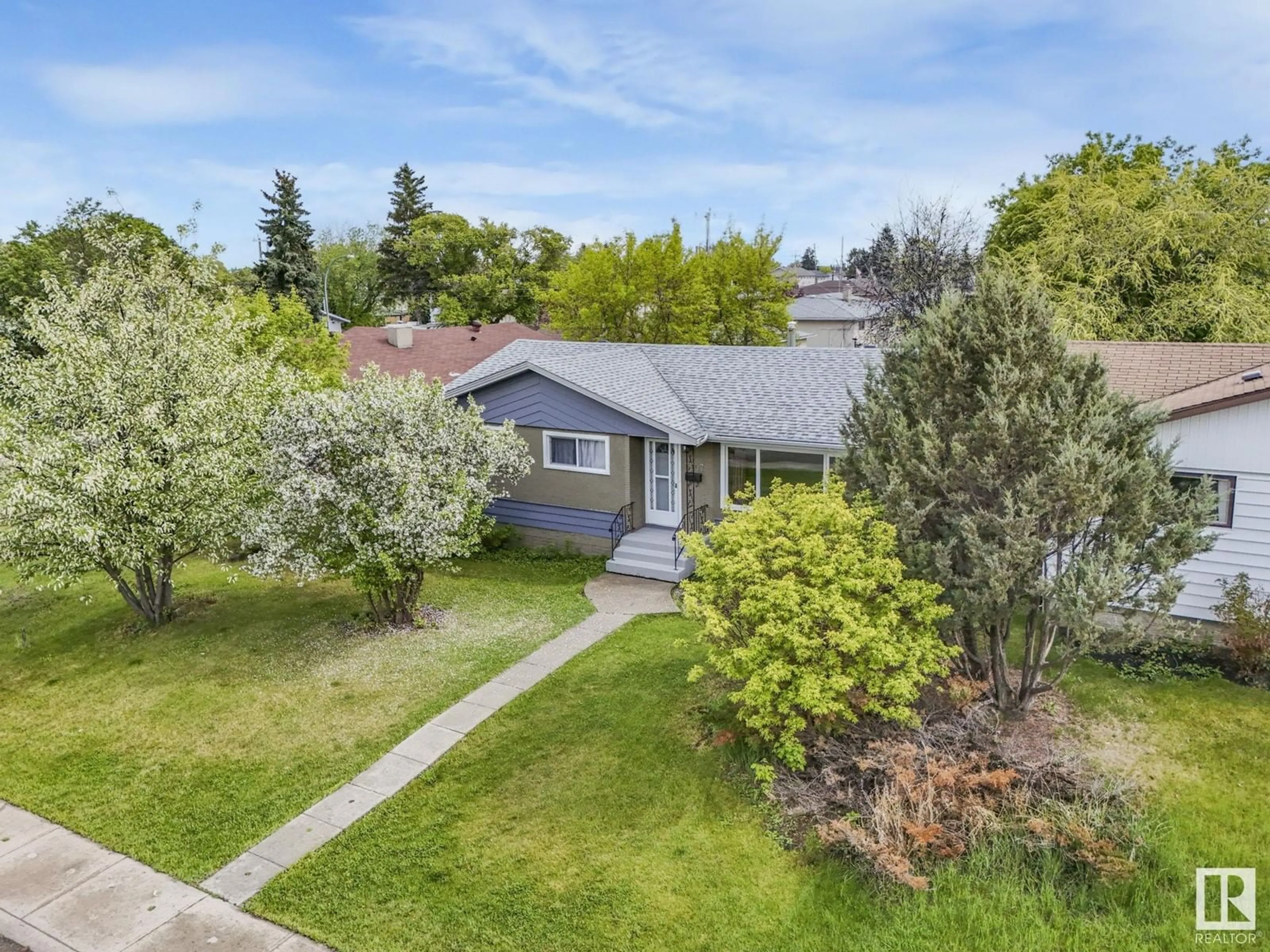 A pic from outside/outdoor area/front of a property/back of a property/a pic from drone, street for 7307 130A AV, Edmonton Alberta T5C1Z1