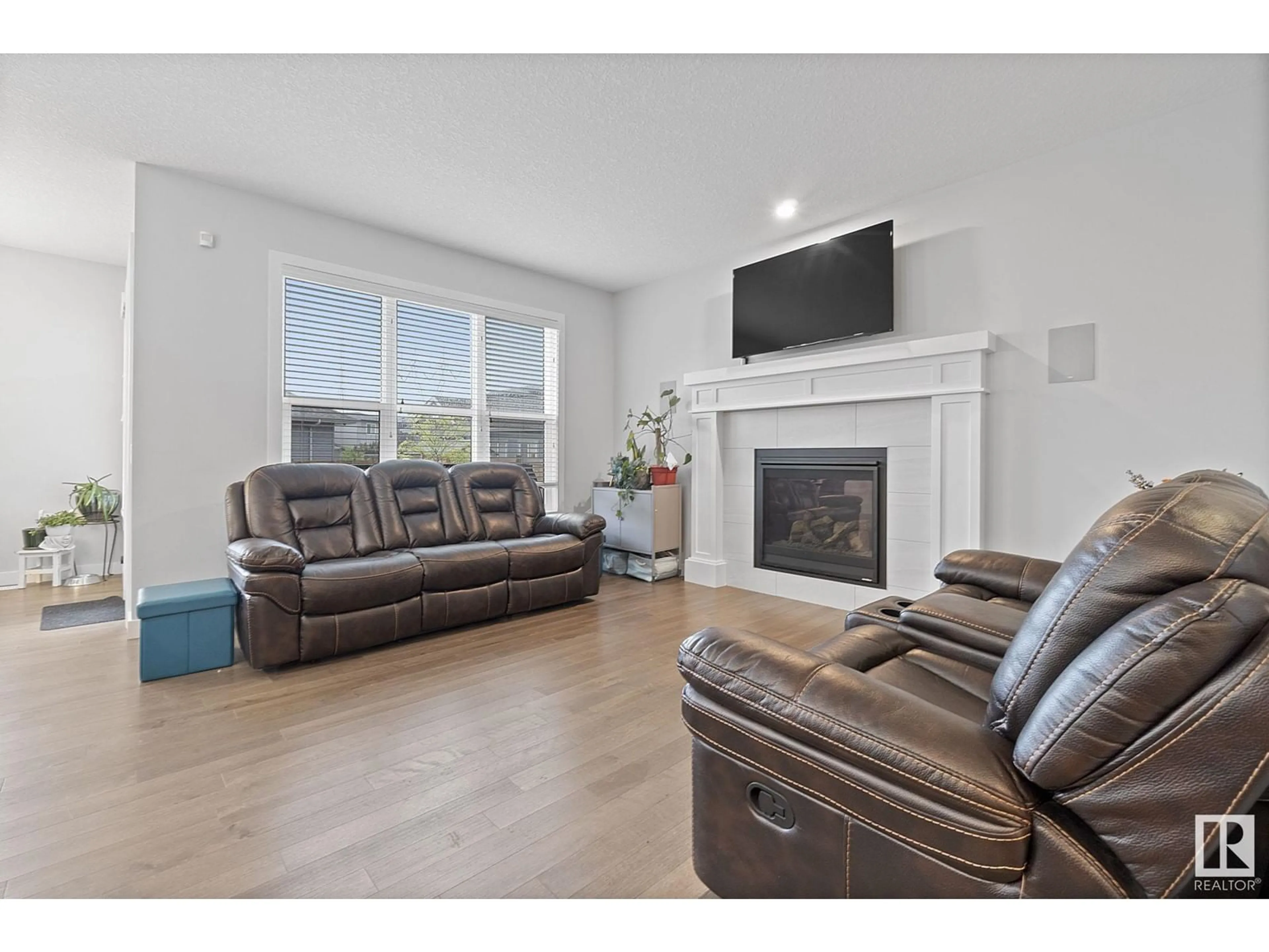 Living room with furniture, wood/laminate floor for 2839 202 ST, Edmonton Alberta T6M0W6
