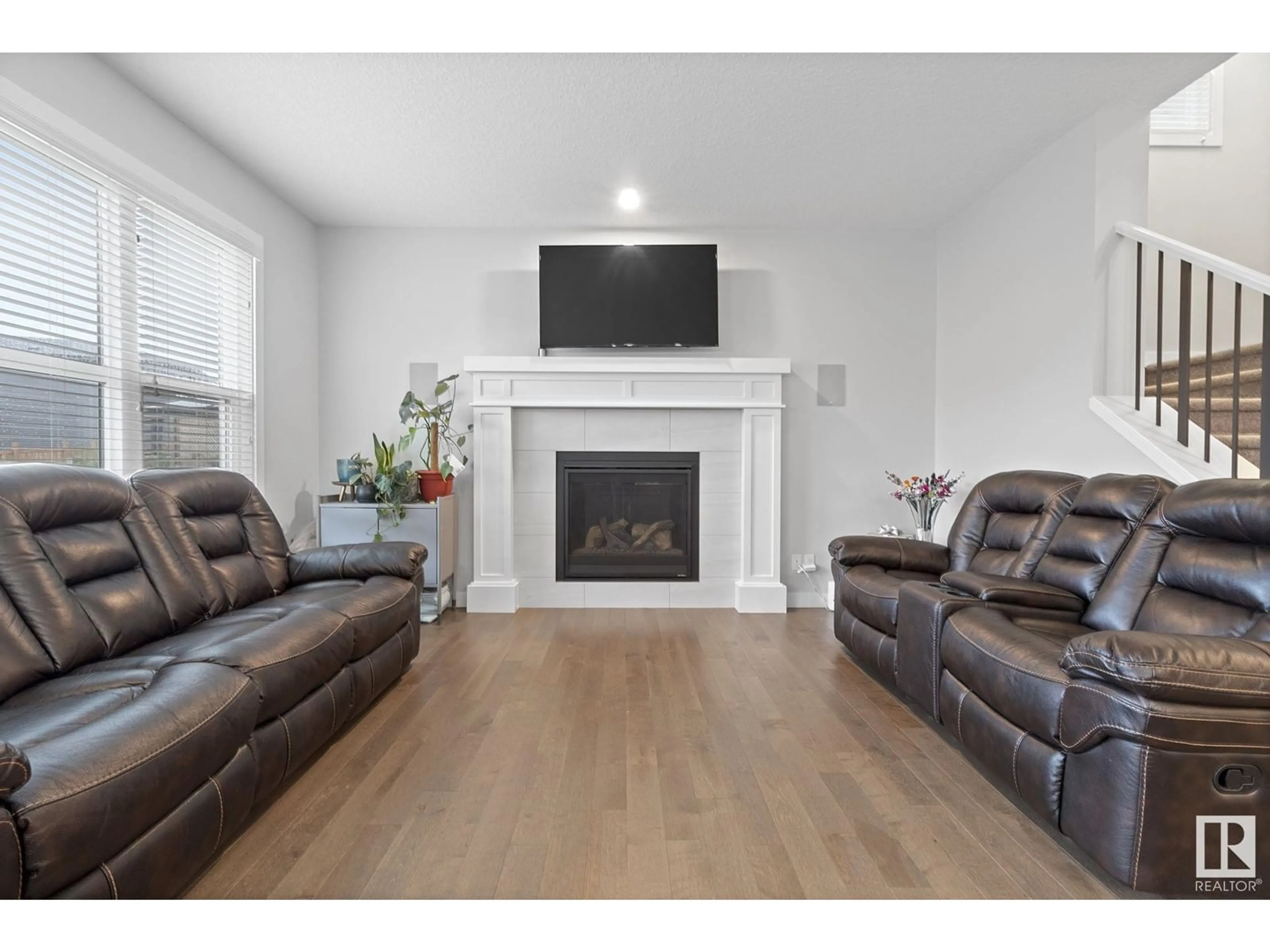 Living room with furniture, wood/laminate floor for 2839 202 ST, Edmonton Alberta T6M0W6