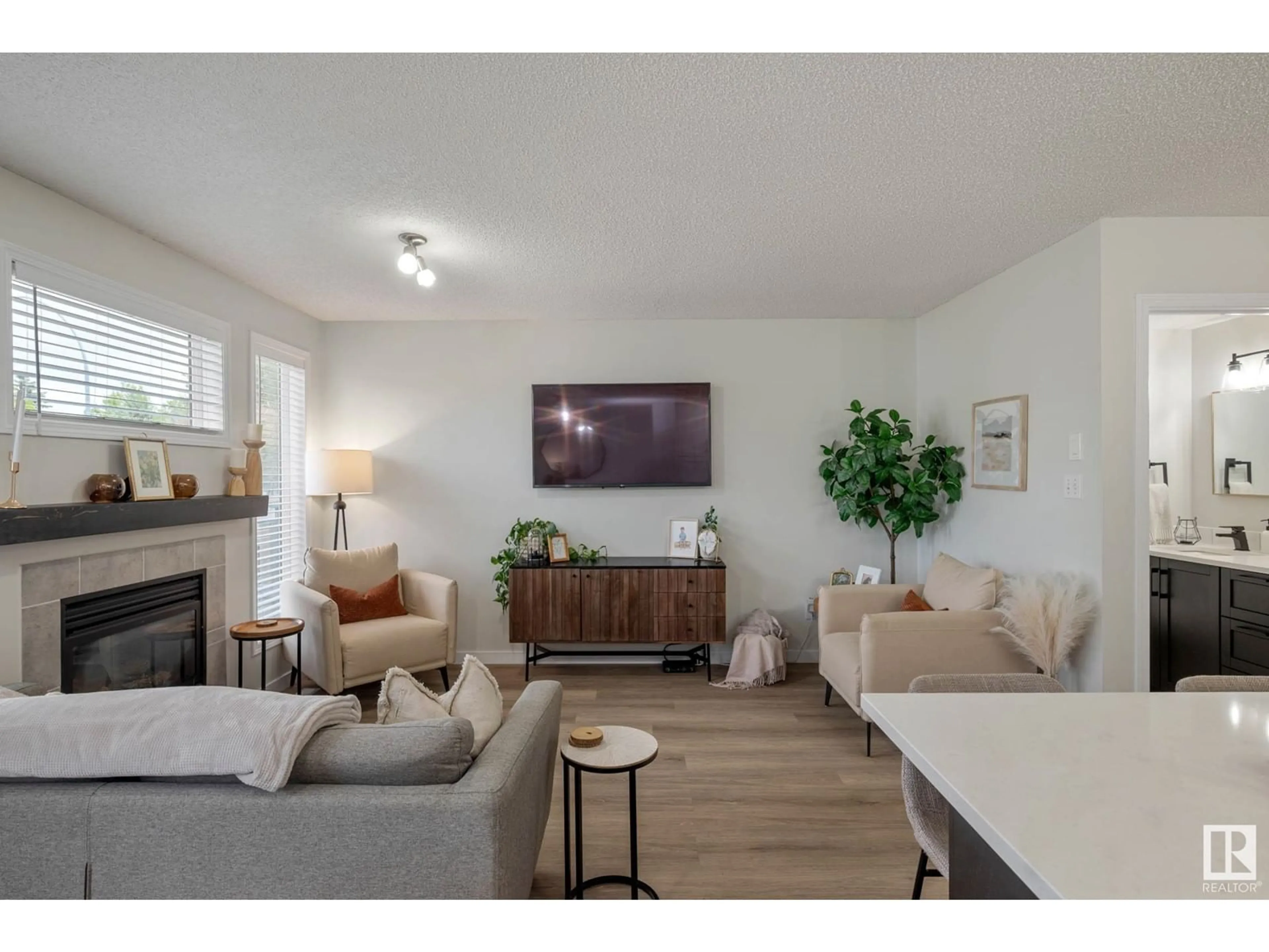 Living room with furniture, wood/laminate floor for NW - 408 HUDSON CO, Edmonton Alberta T6V1S7