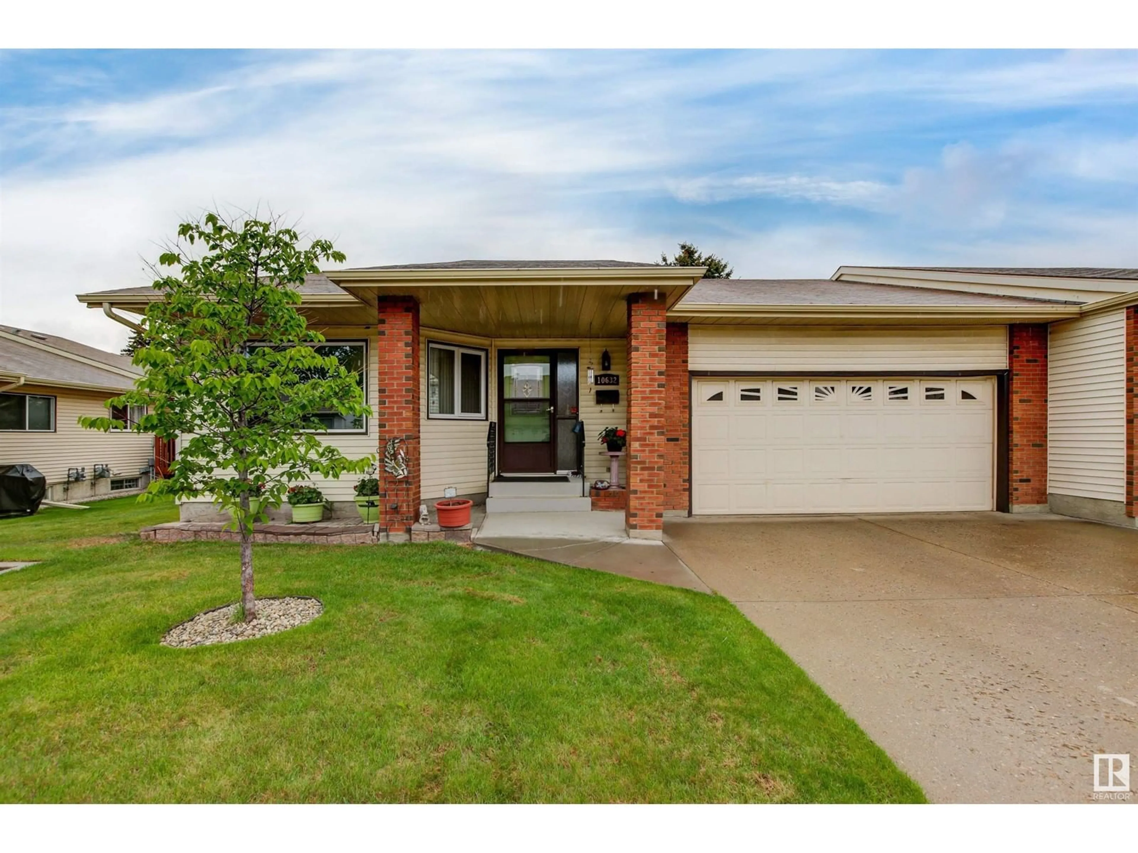 Home with brick exterior material, street for NW - 10632 153 AV, Edmonton Alberta T5X5R5