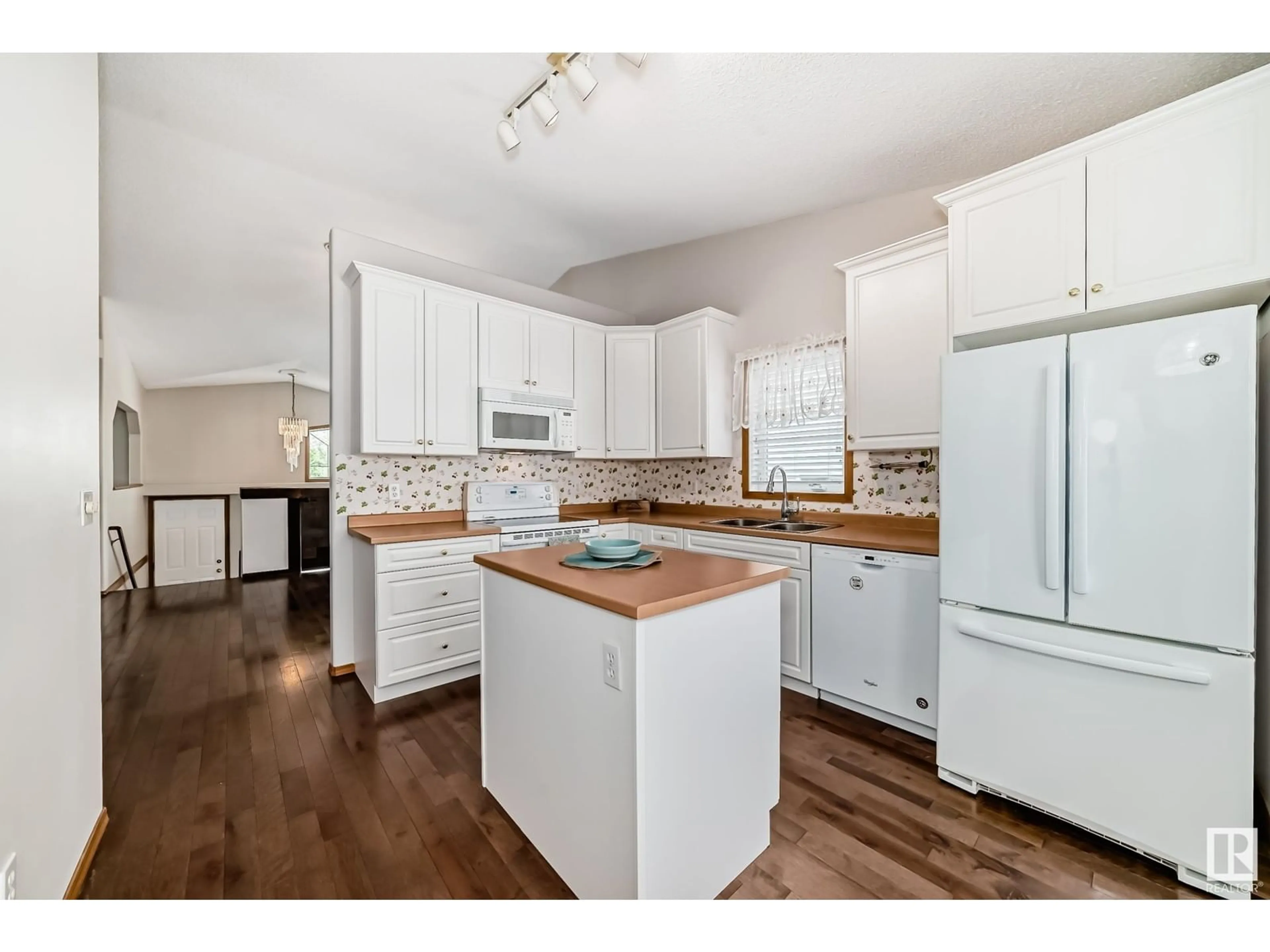 Open concept kitchen, wood/laminate floor for 80 CACTUS WY, Sherwood Park Alberta T8H1T2