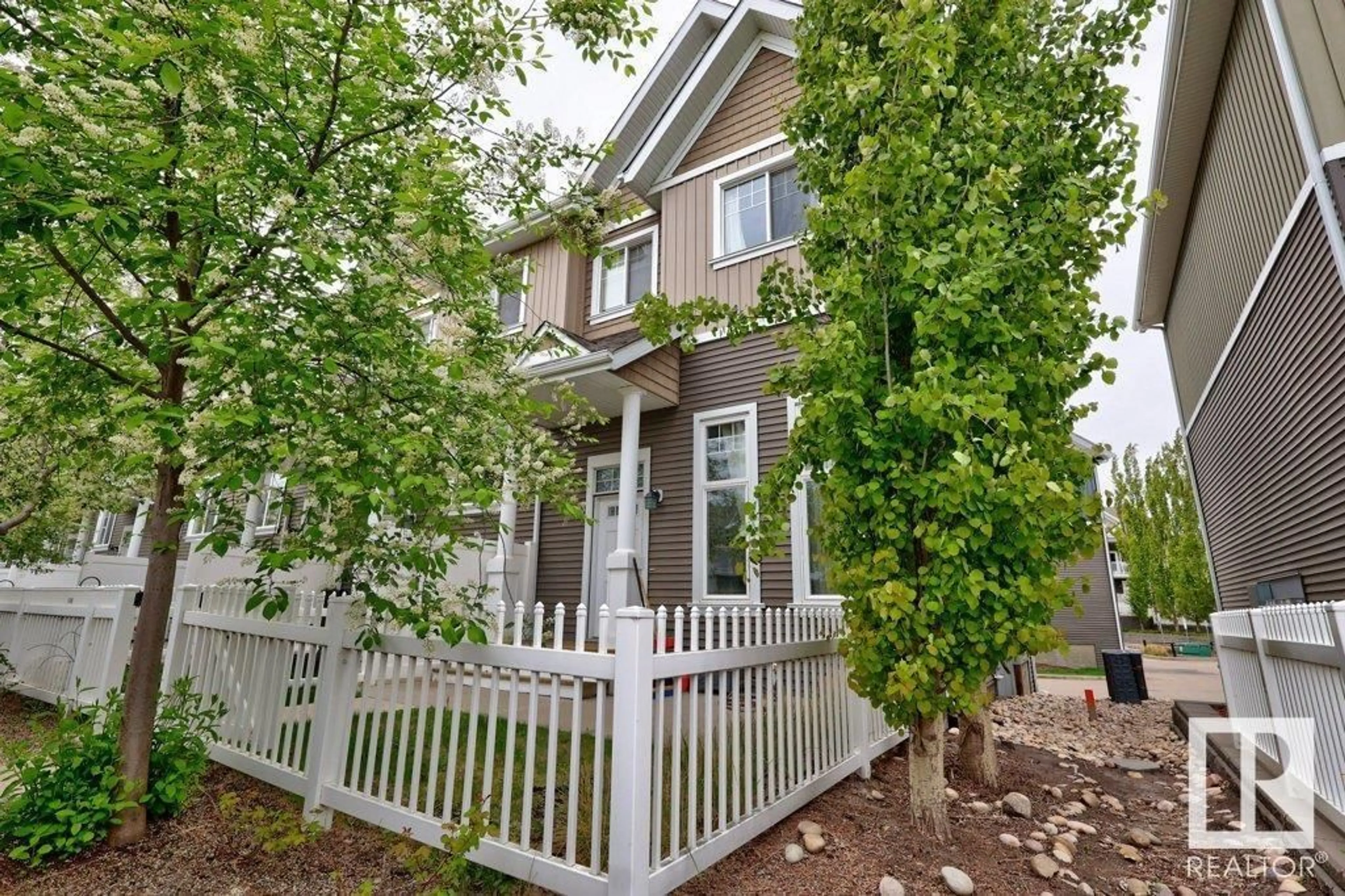 Home with vinyl exterior material, street for #33 - 4050 SAVARYN DR, Edmonton Alberta T6X1R8