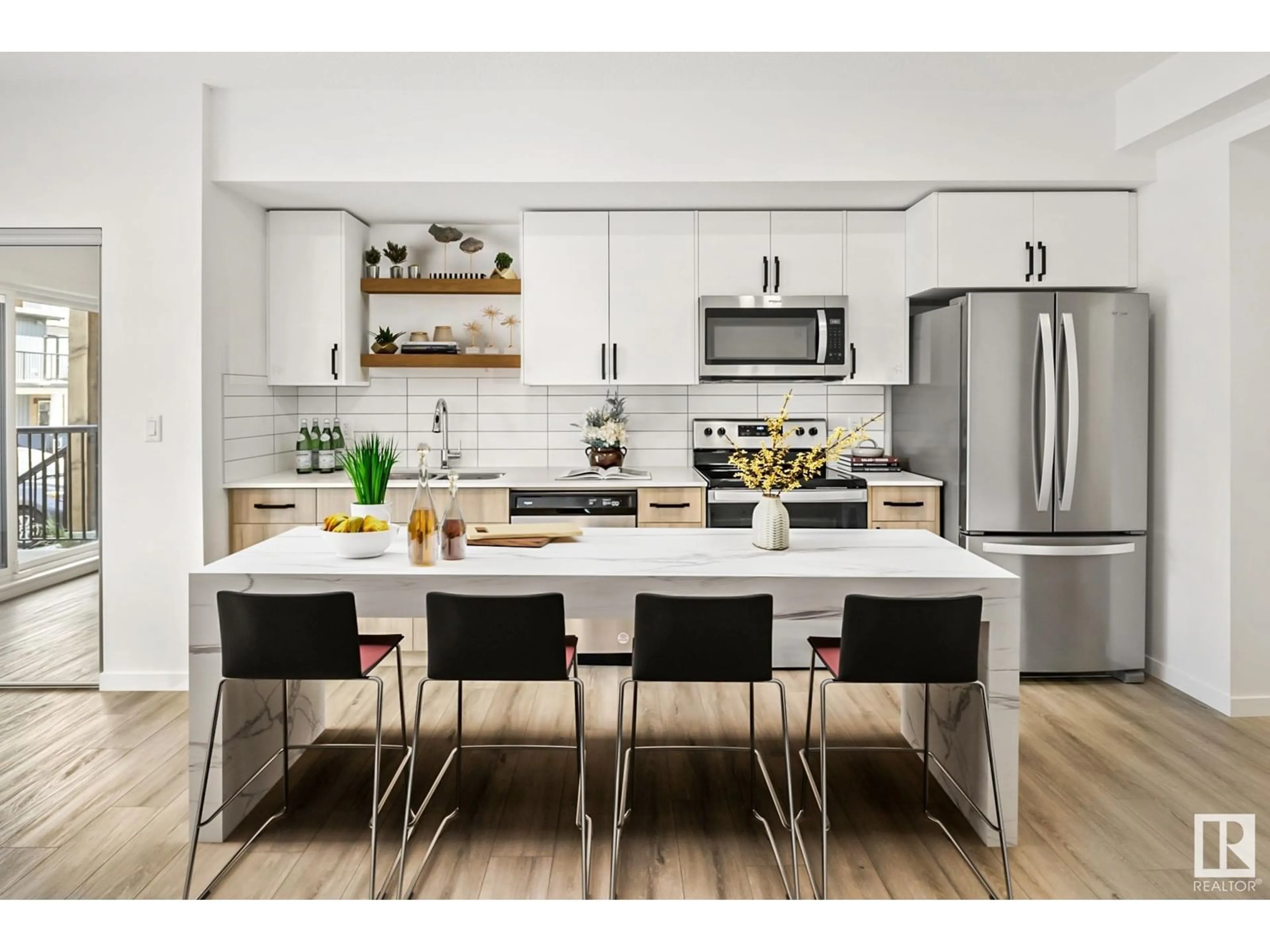Open concept kitchen, wood/laminate floor for 860 - 101 SECORD BV, Edmonton Alberta T5T7R9