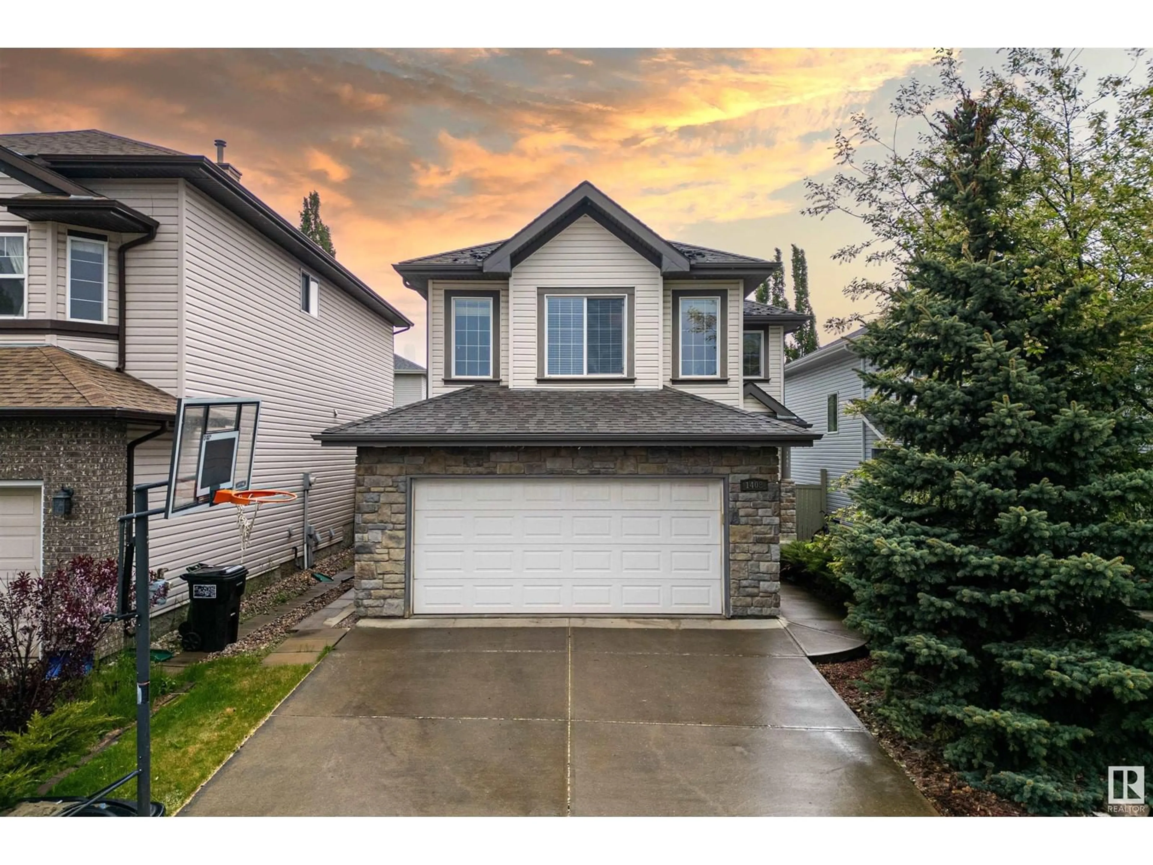Home with vinyl exterior material, street for NW - 1408 LATTA CO, Edmonton Alberta T6R3N2