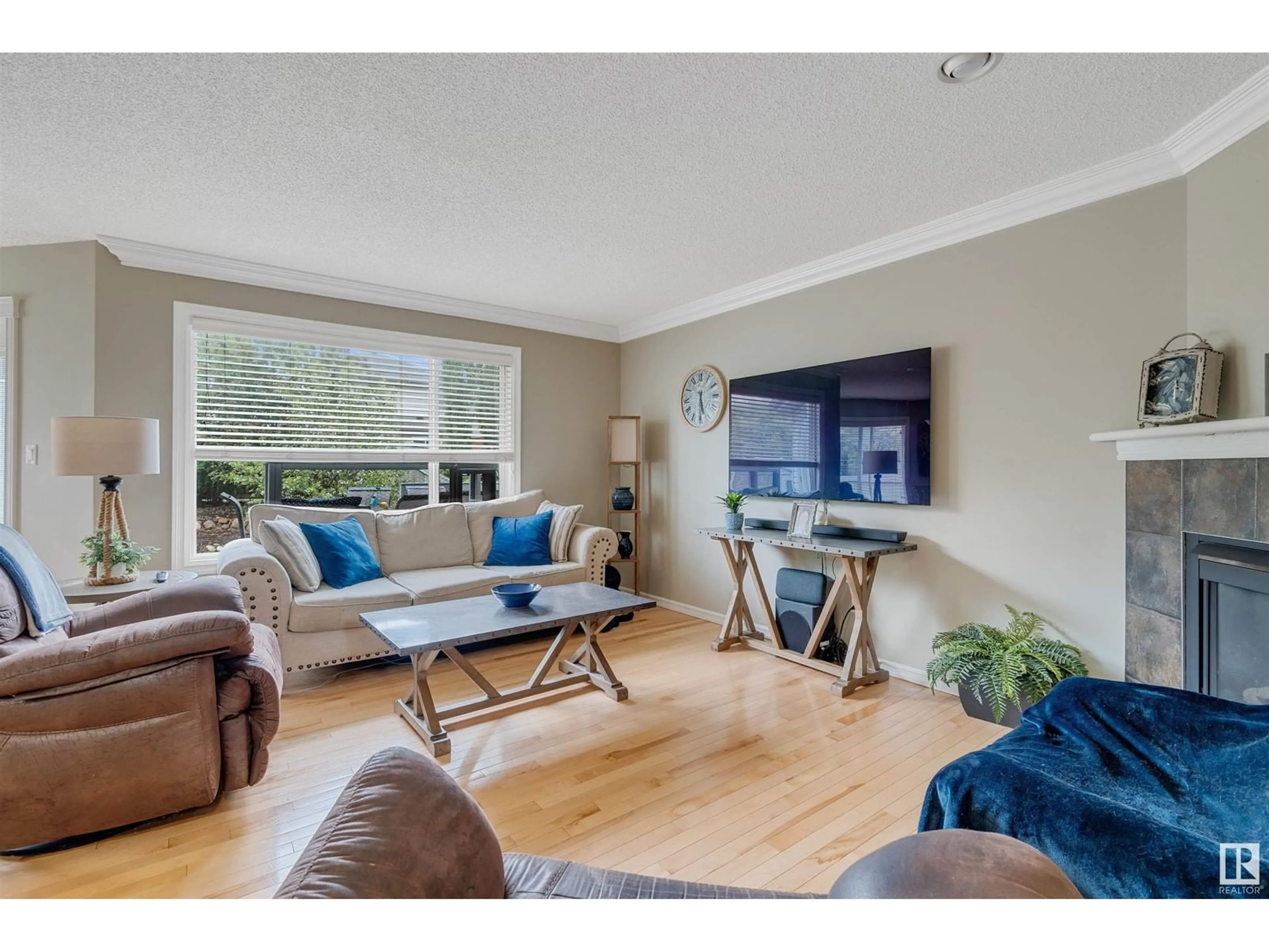 Living room with furniture, wood/laminate floor for NW - 1408 LATTA CO, Edmonton Alberta T6R3N2