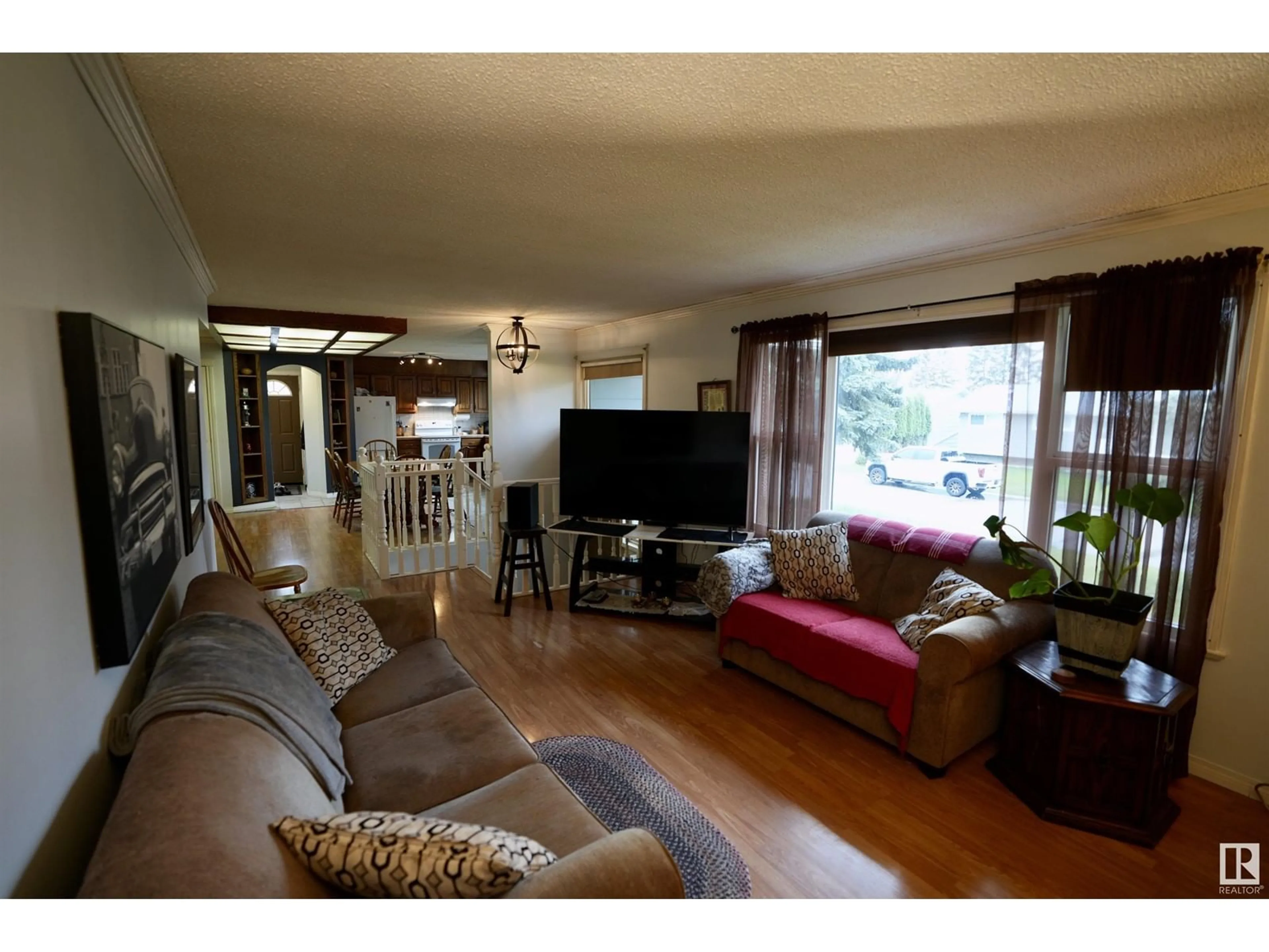 Living room with furniture, wood/laminate floor for 5114 56A AV, Elk Point Alberta T0A1A0
