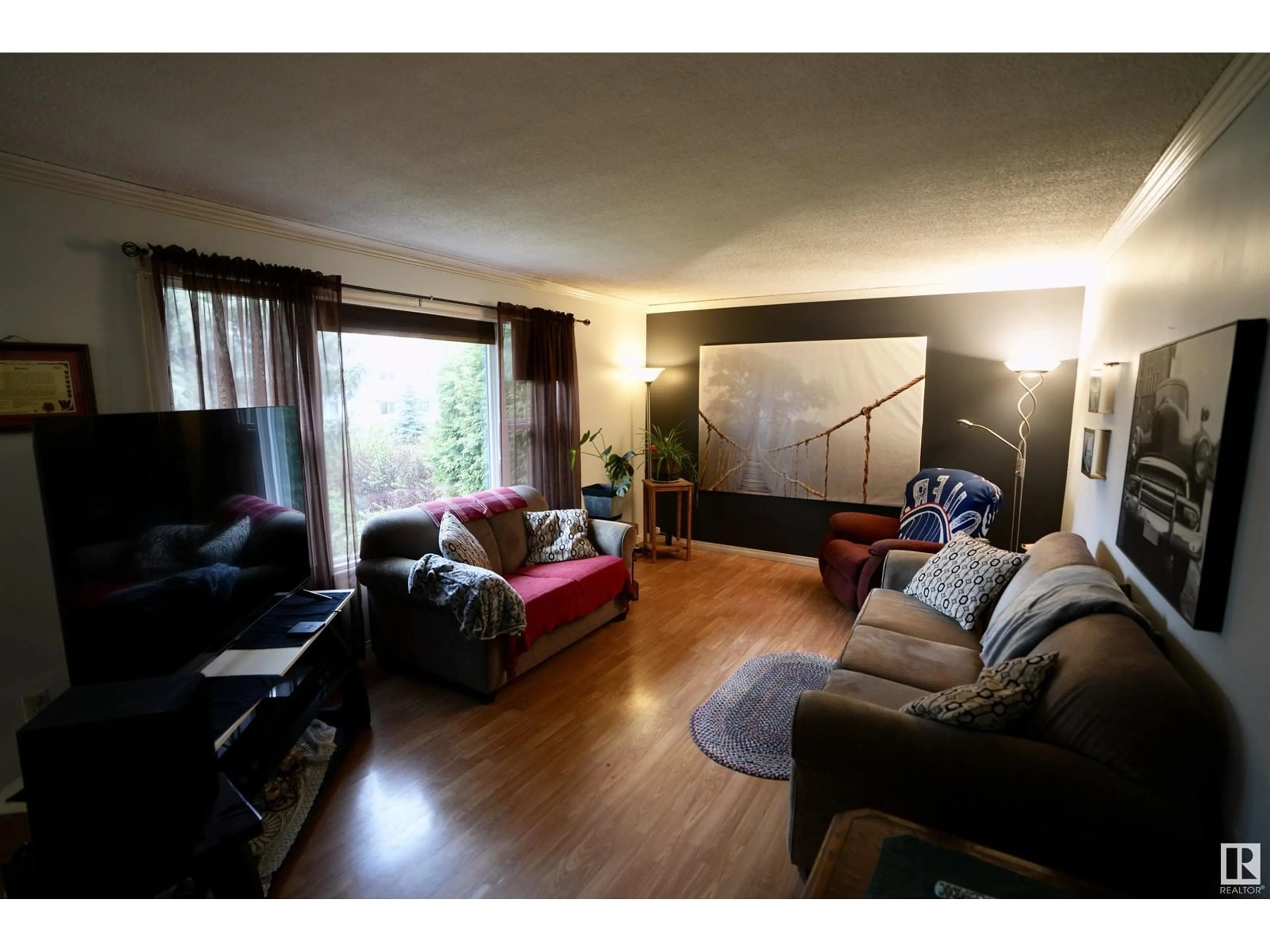 Living room with furniture, wood/laminate floor for 5114 56A AV, Elk Point Alberta T0A1A0