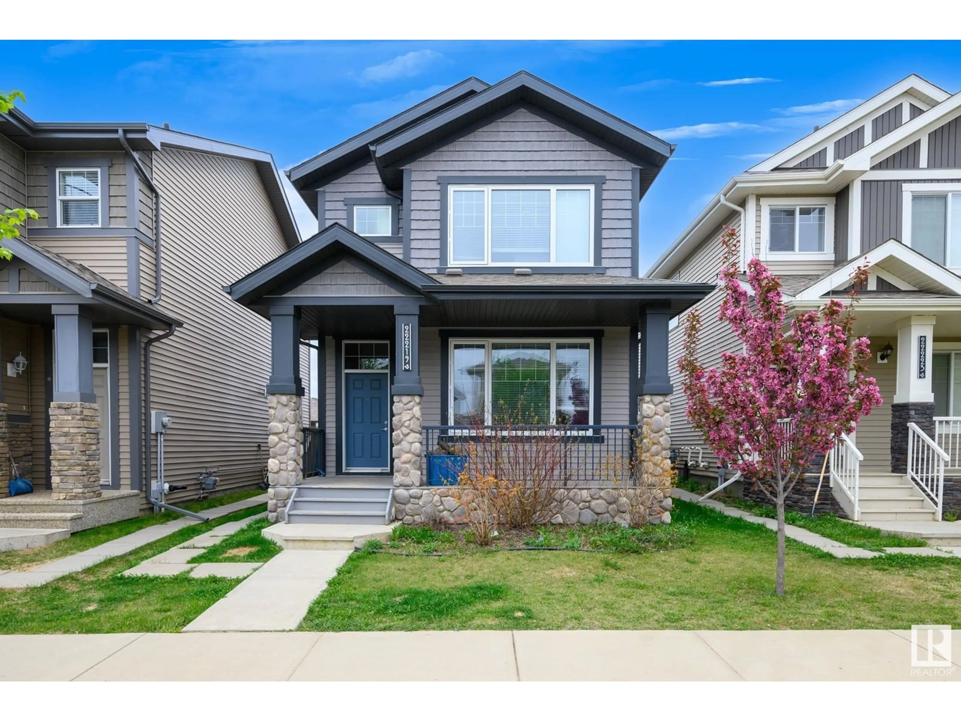 Home with vinyl exterior material, street for NW - 22219 88 AV, Edmonton Alberta T5T7H2