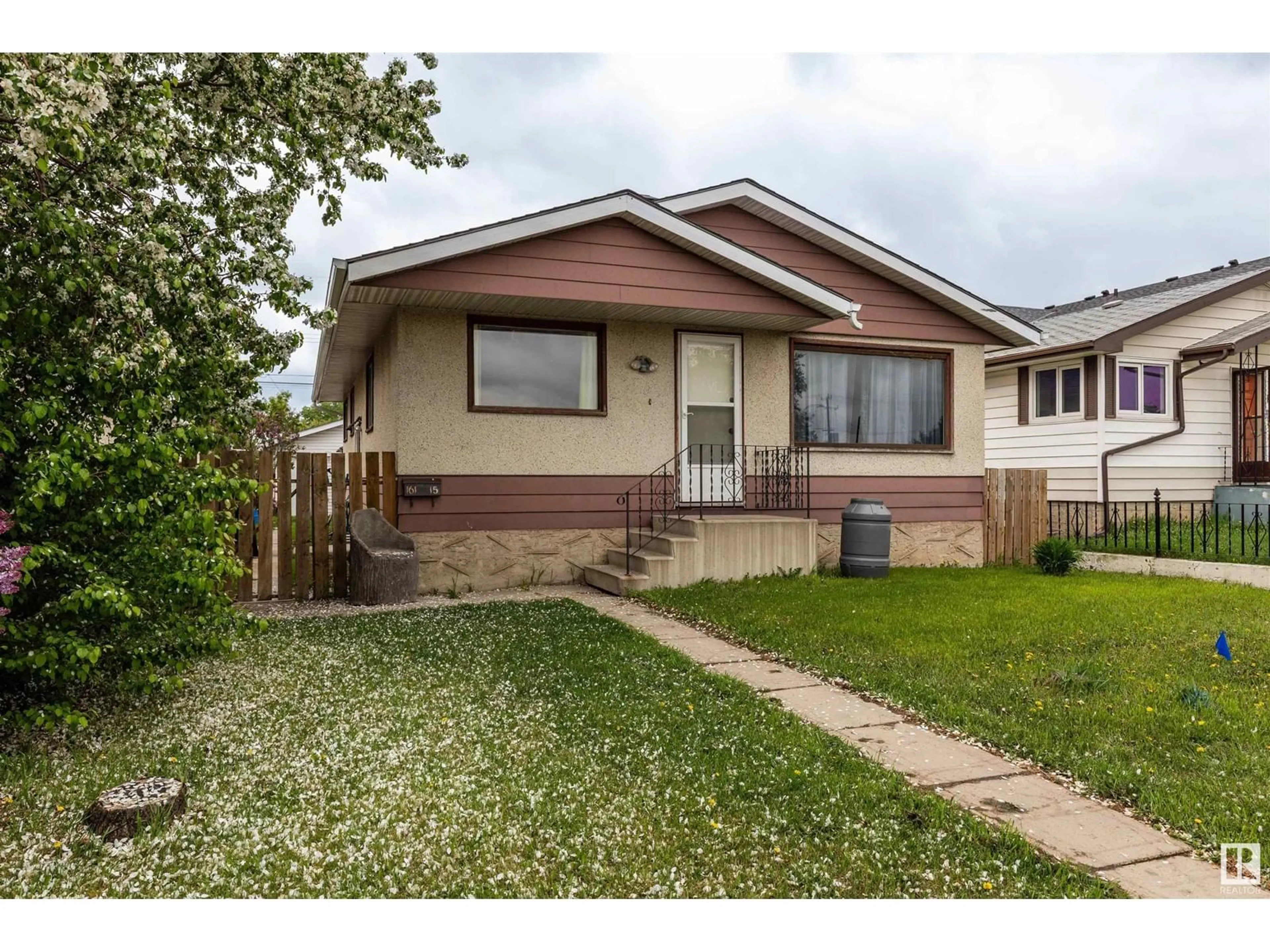 Home with vinyl exterior material, street for 16115 100A AV, Edmonton Alberta T5P0L9